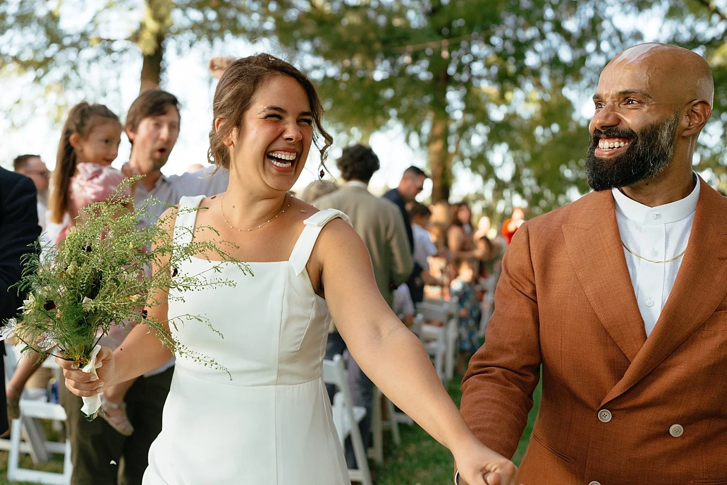  newlyweds exit their outdoor ceremony at Springs Lake Ranch 