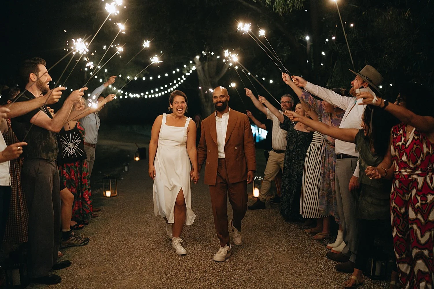  husband and wife go through sparkler exit at their reception at Springs Lake Ranch 