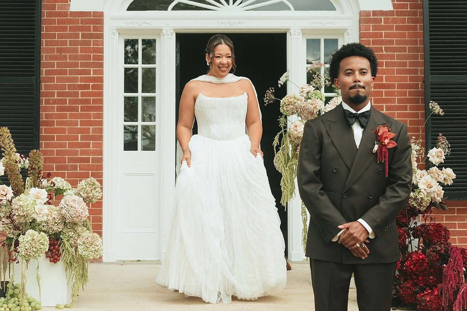  bride approaches her groom at the bottom of steps by Austin wedding photographer 