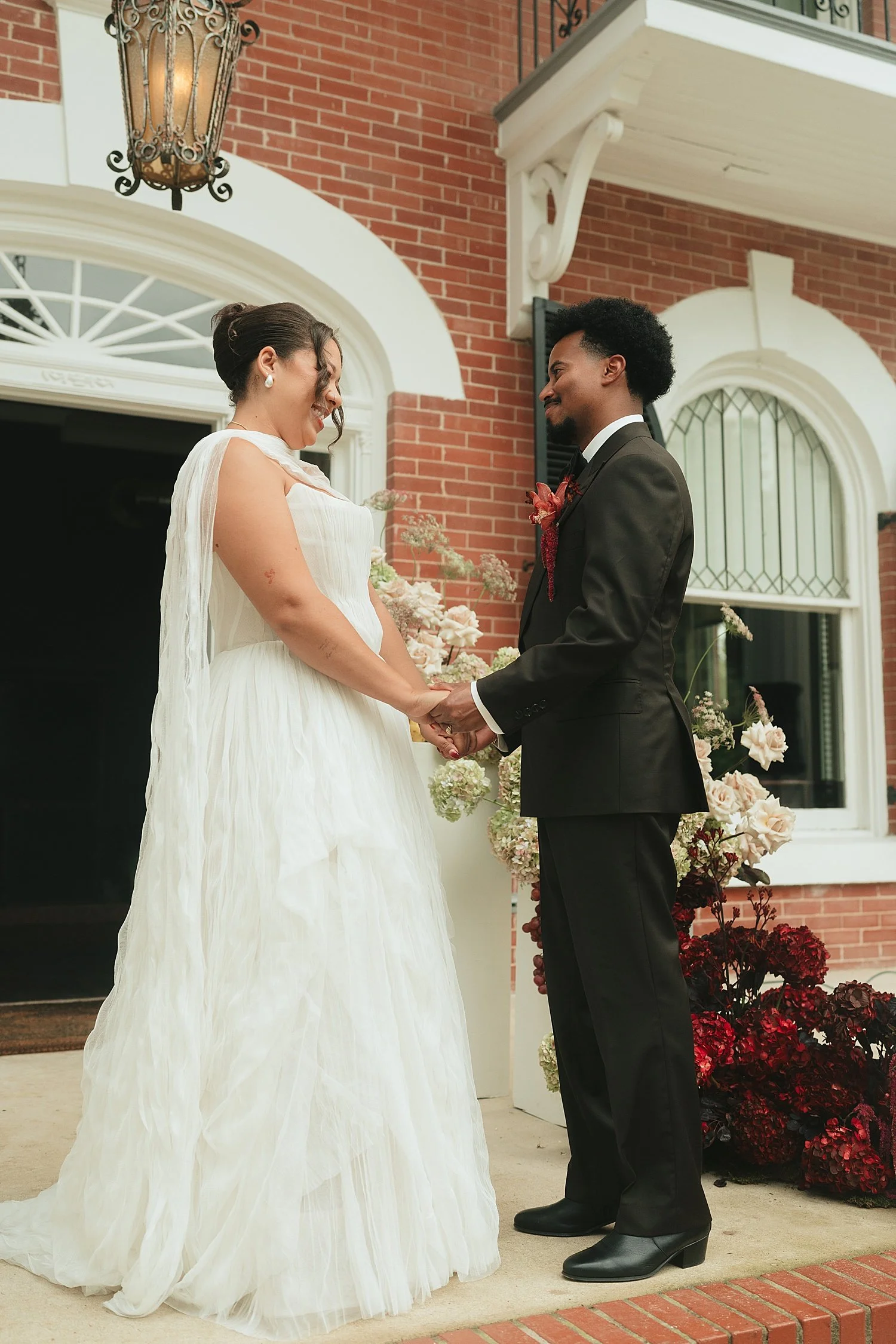  couple holds hands on steps after first look by Jessica Joseph Photography 