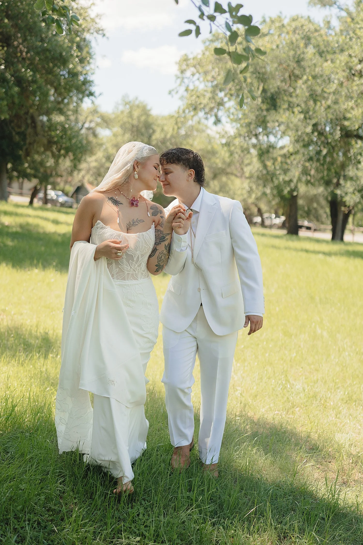  couple walking together across the lawn at venue by Jessica Joseph Photography 
