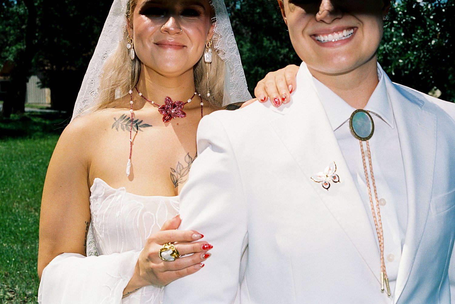  couple stand in direct sun on their special day by Austin wedding photographer 