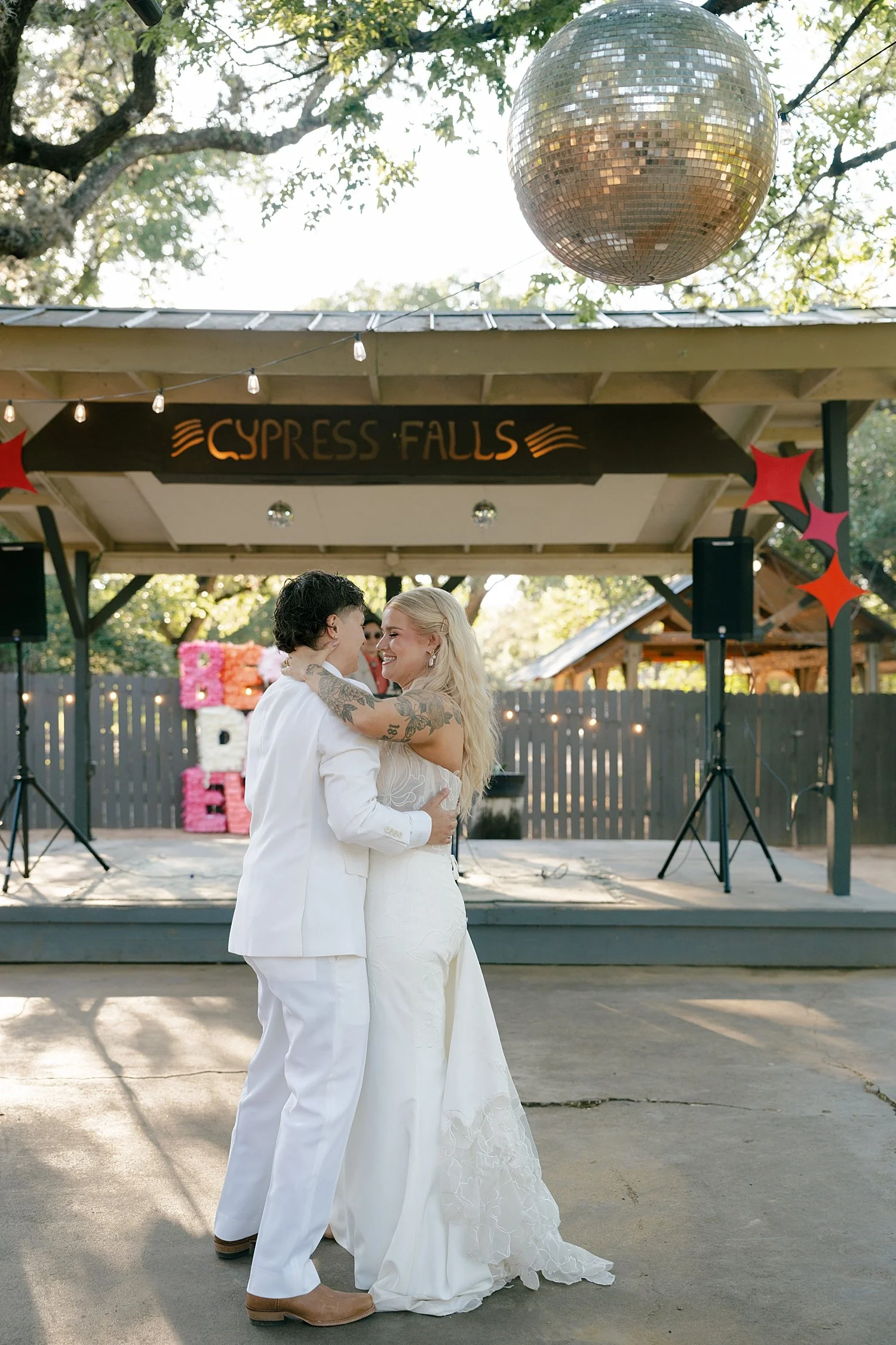  brides share a first dance on patio by Jessica Joseph Photography 