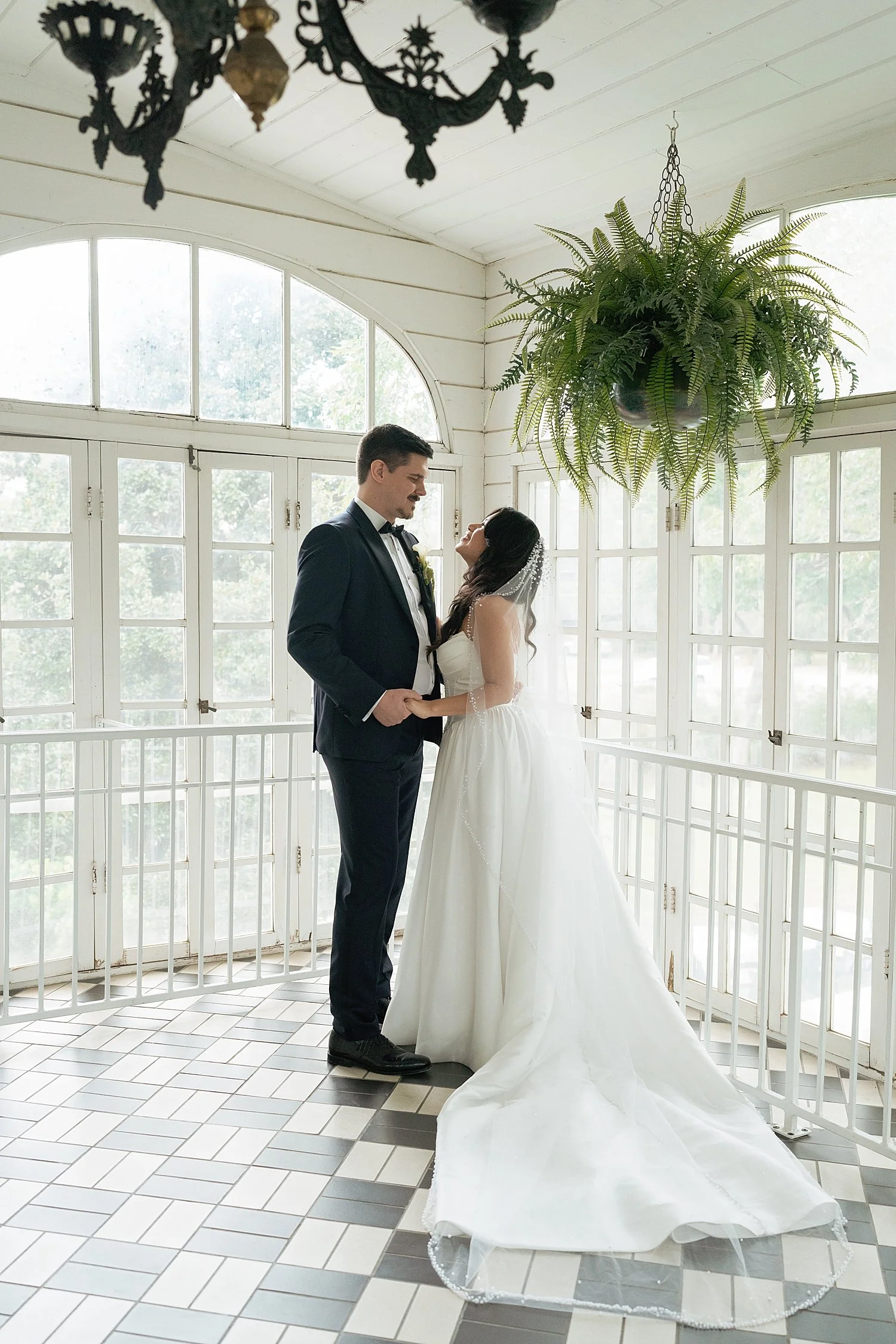  bride and groom in greenroom with black and white checkered floors by Austin Wedding Photographer 