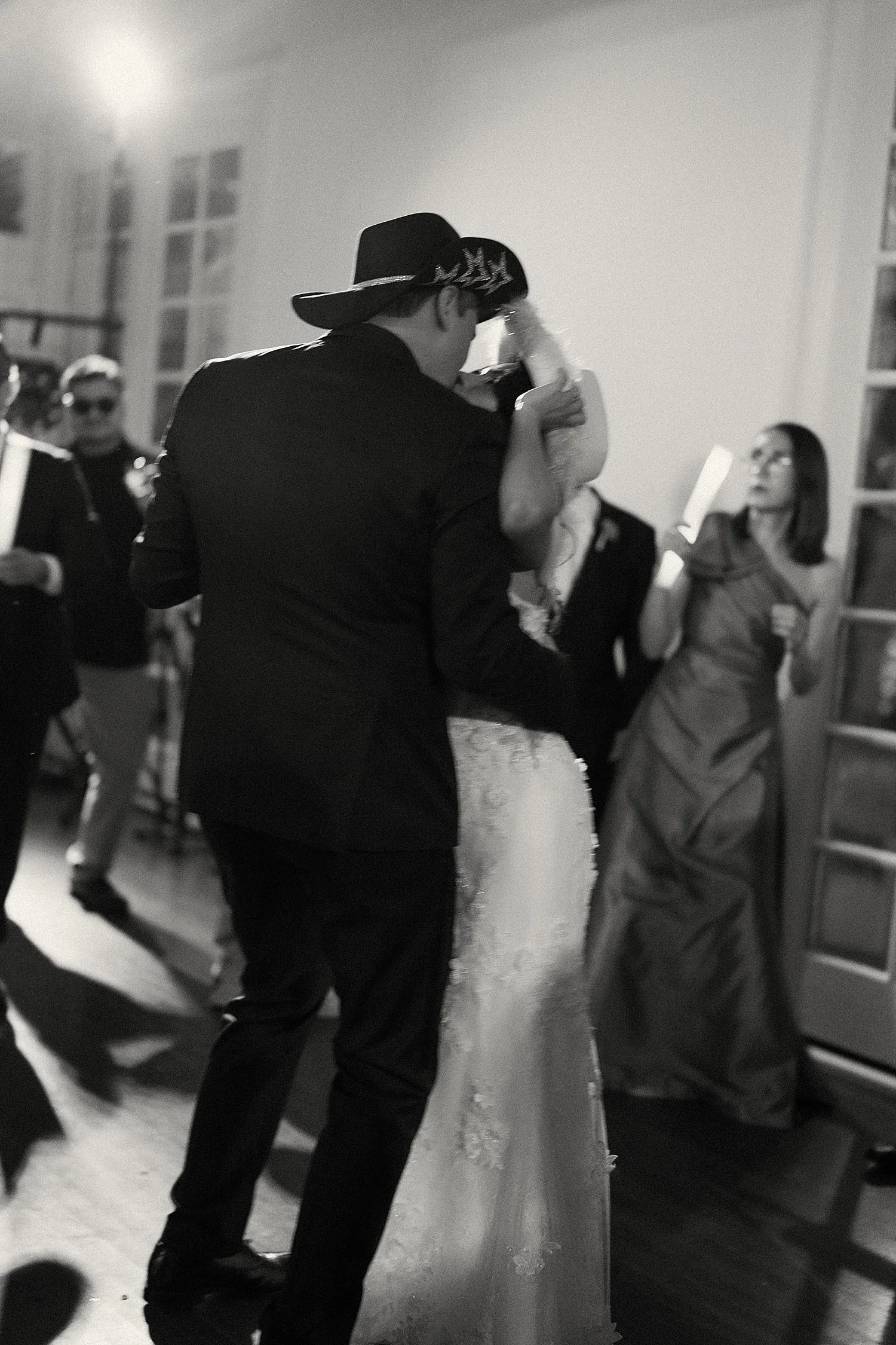  newlyweds dance with their friends at reception at Woodbine Mansion 