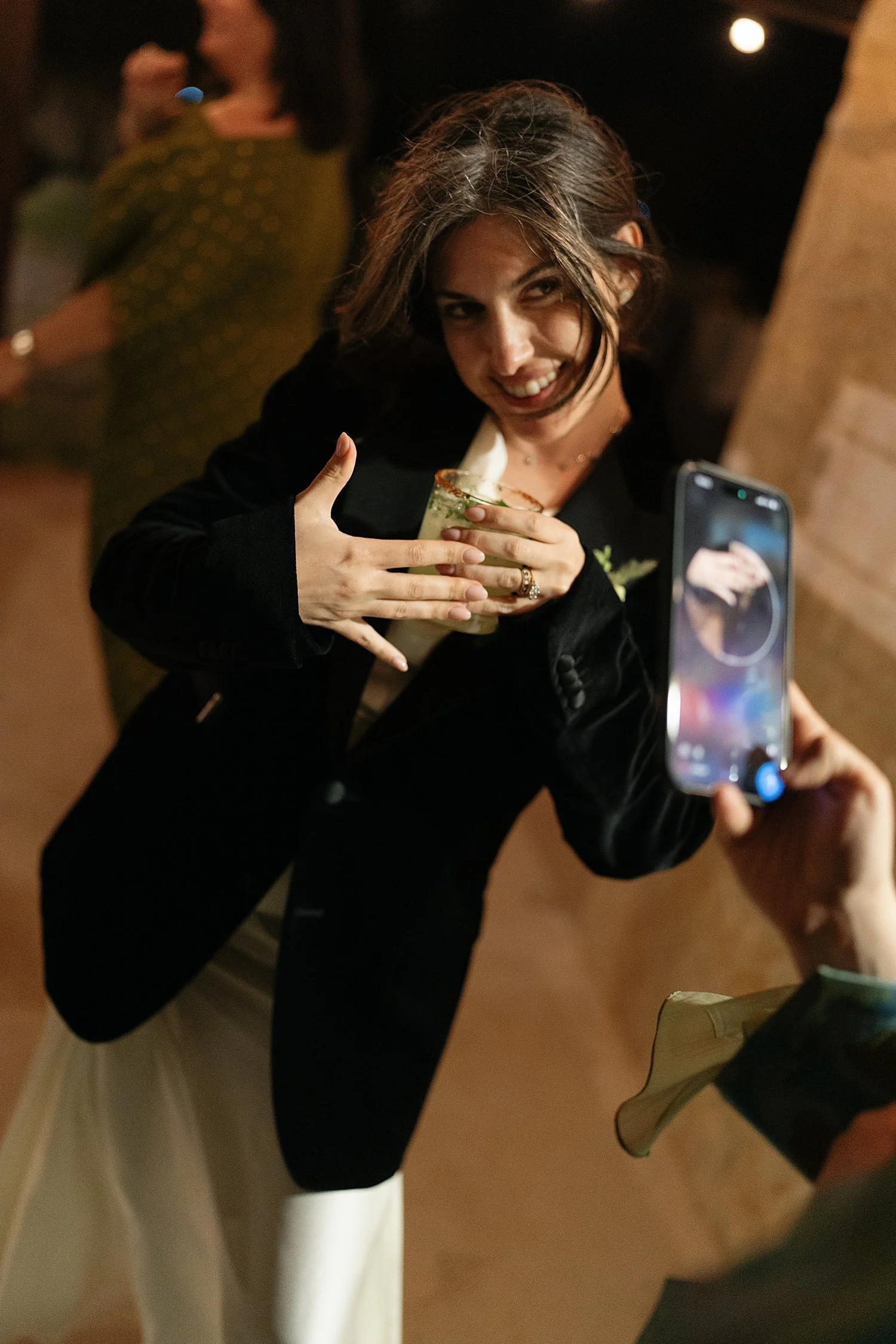  woman shows off her new ring at reception by Austin photographer 
