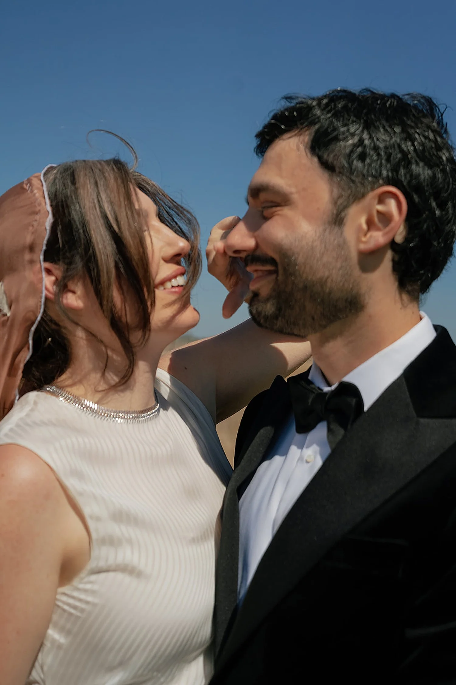  groom looks lovingly at his new wife for backyard wedding in Texas Hill Country 