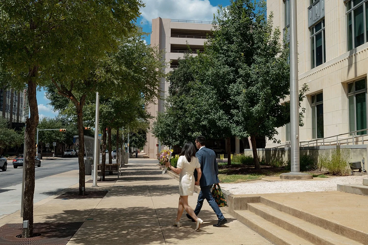  man and woman walk away from courthouse after getting married by Jessica Joseph Photography 