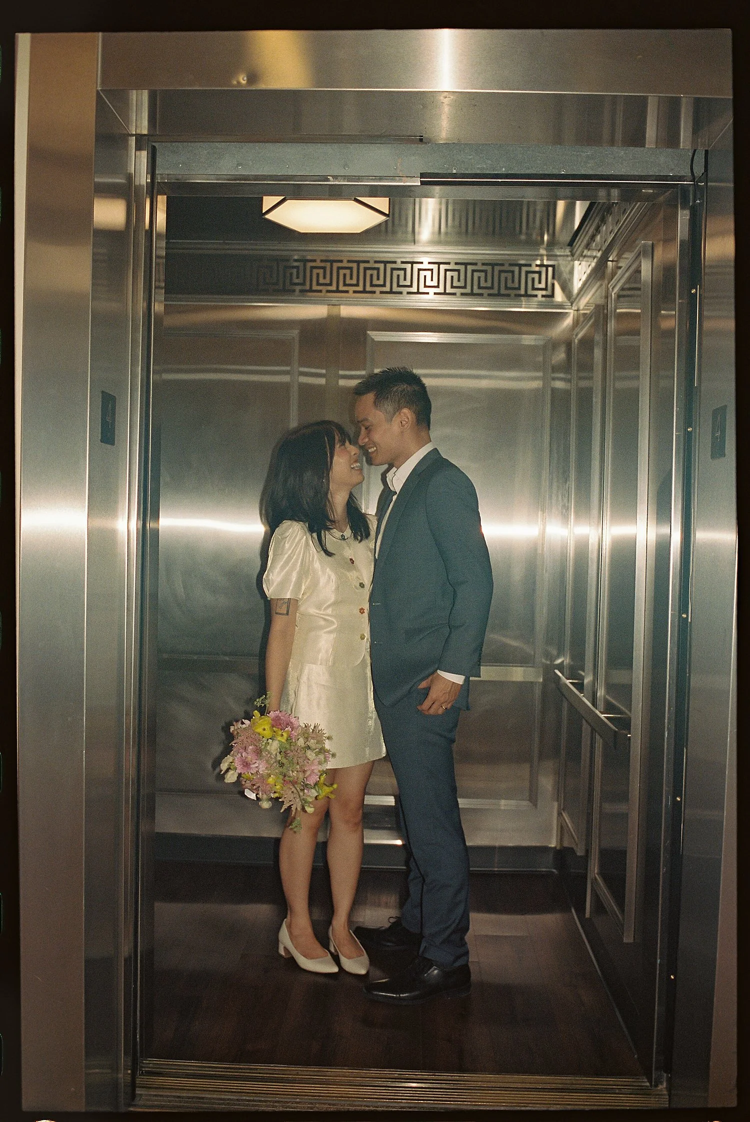  newlyweds kiss in elevator for a quintessential Austin elopement 
