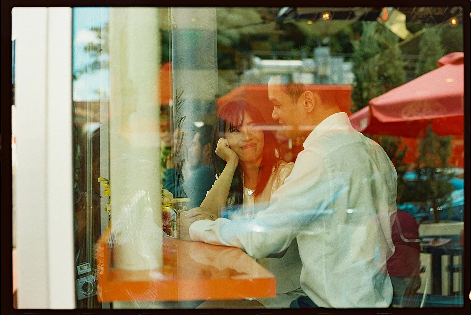  man and woman sitting in a restaurant by Jessica Joseph Photography 