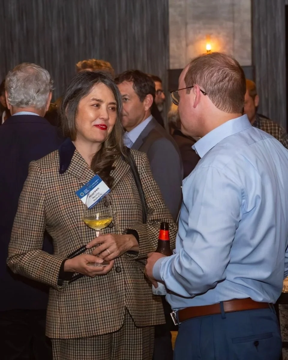 Energy professionals discussing industry opportunities at a networking event.