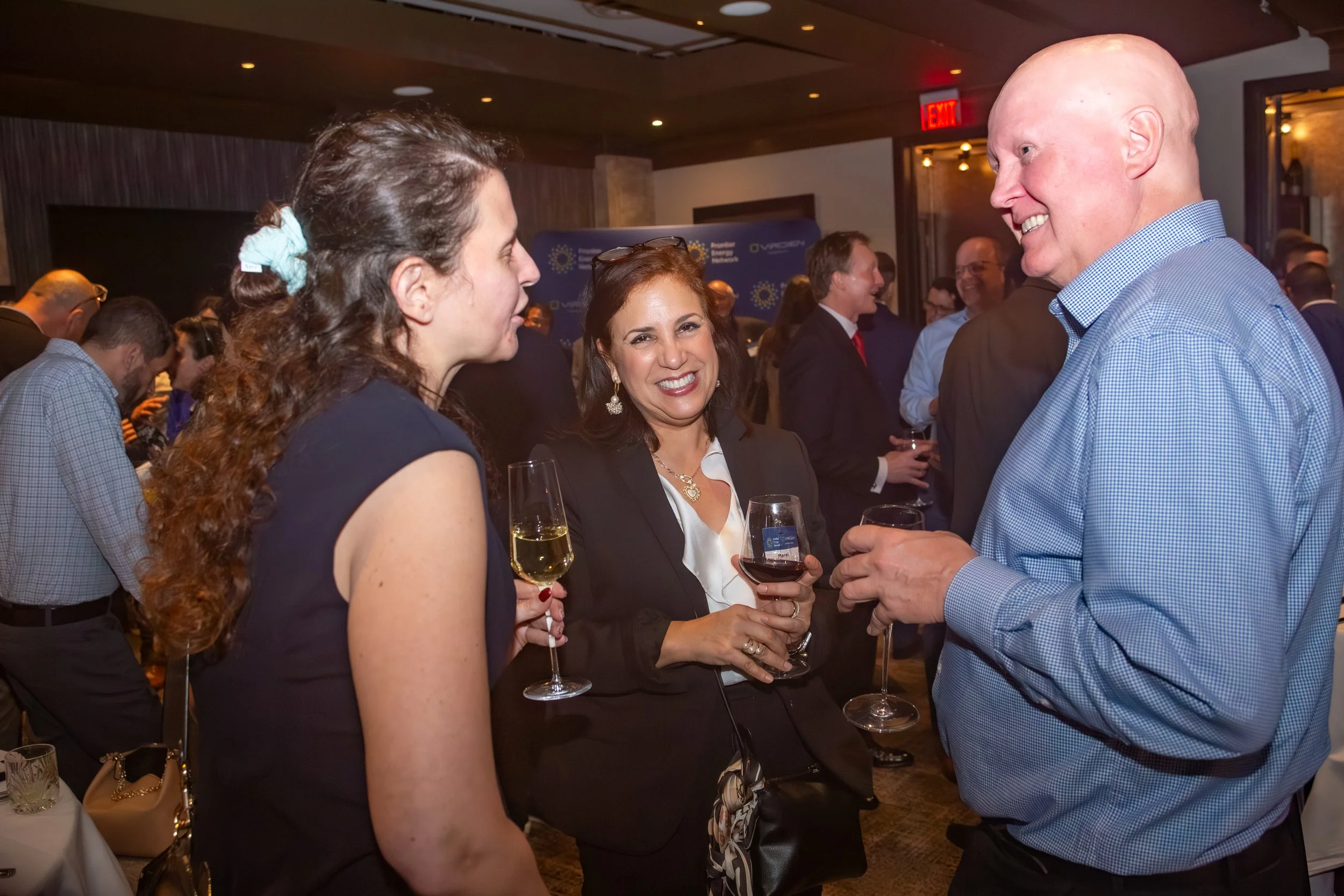 Industry leaders networking and connecting during an energy sector event.