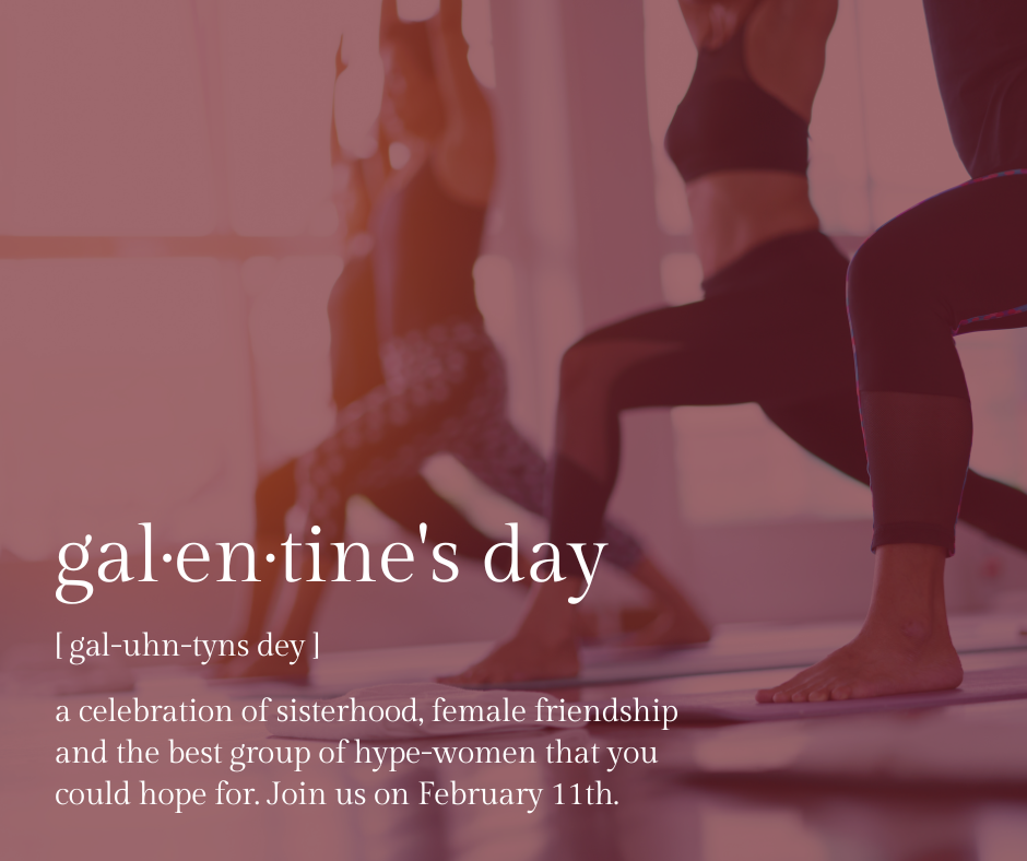 Women practicing yoga in a studio celebrating Galentine's Day with a focus on sisterhood and friendship.