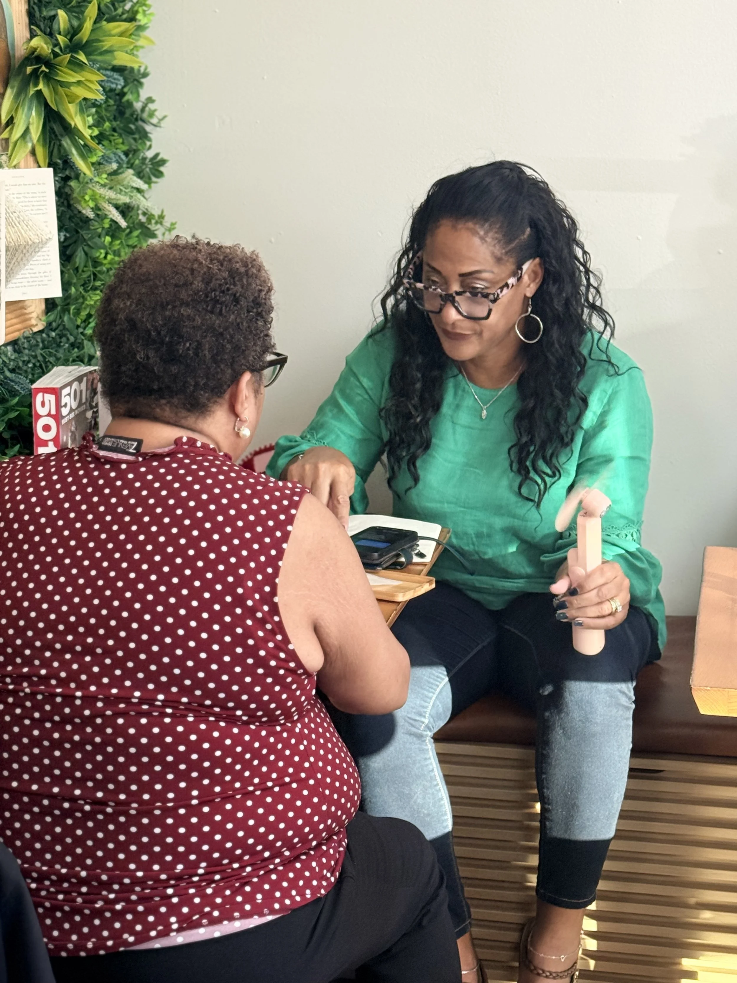 Examining  prompts at Flakes & Fables cafe attending FAF conversation and journaling. 