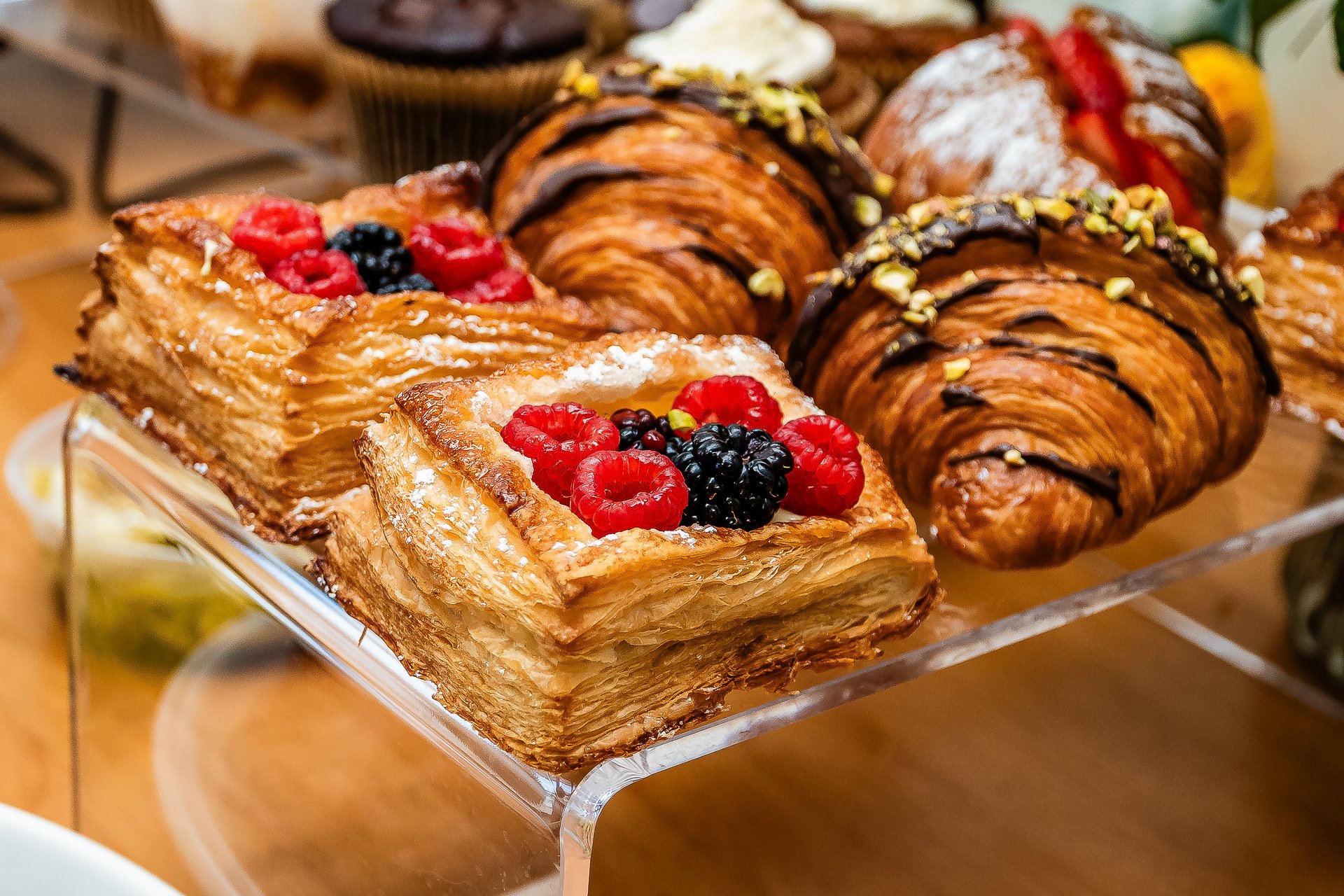 Assorted pastries with berries and chocolate }