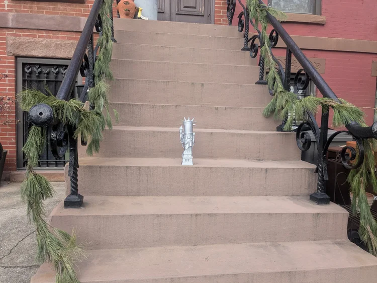 LIBBY trophy on a brownstone stoop