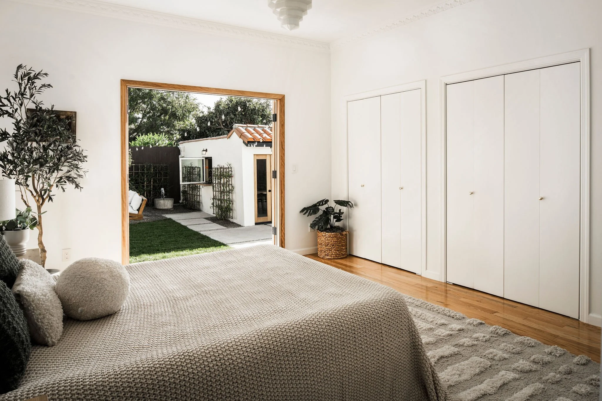 Interior of a bedroom showing the new patio doors opening.