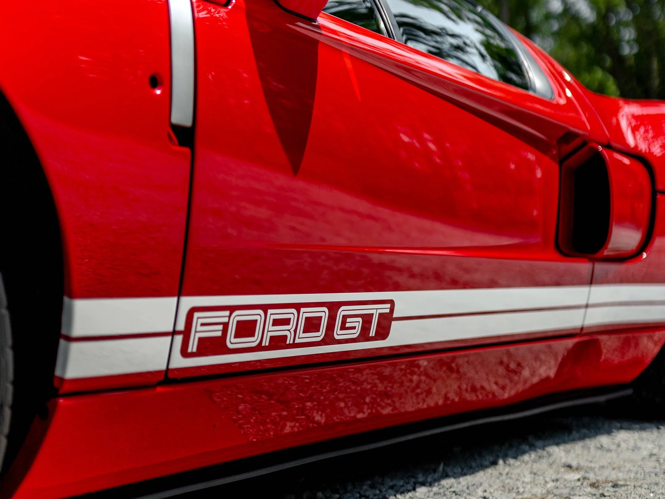 EPM Detailing Enhancement Paint Correction Package: Close-Up of red Ford GT Detailing showcasing enhanced gloss and refined finish.
