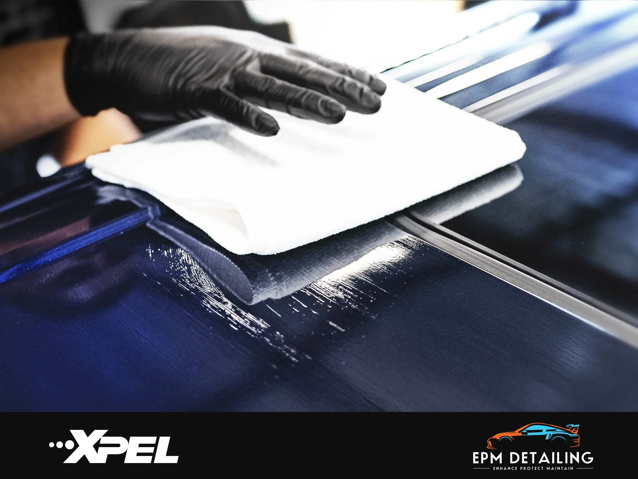 EPM Detailing XPEL FUSION PLUS Ceramic Coating Two-Stage Package: Close-up of a gloved hand applying ceramic coating with a white cloth below the windshield of a black car.