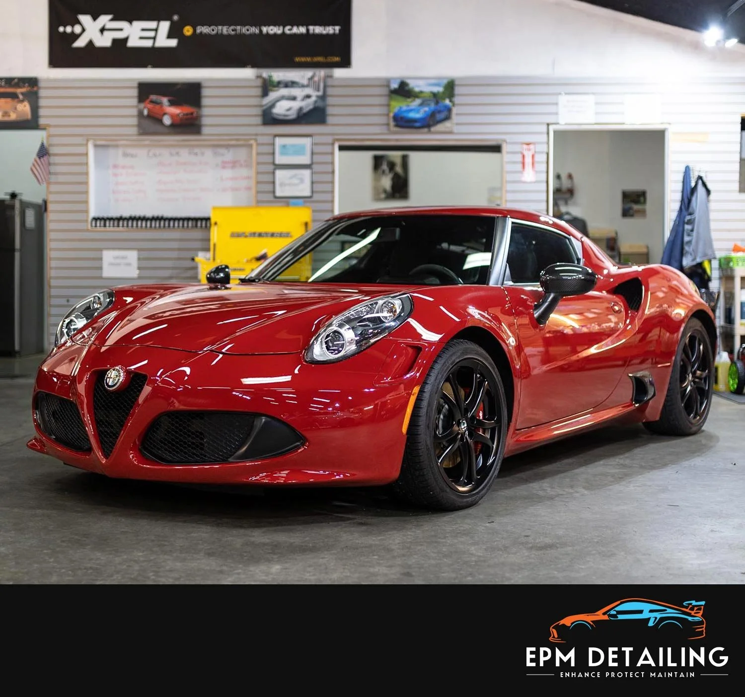 EPM Detailing shop interior featuring a red Alfa Romeo 4C, showcasing premium vehicle detailing services.