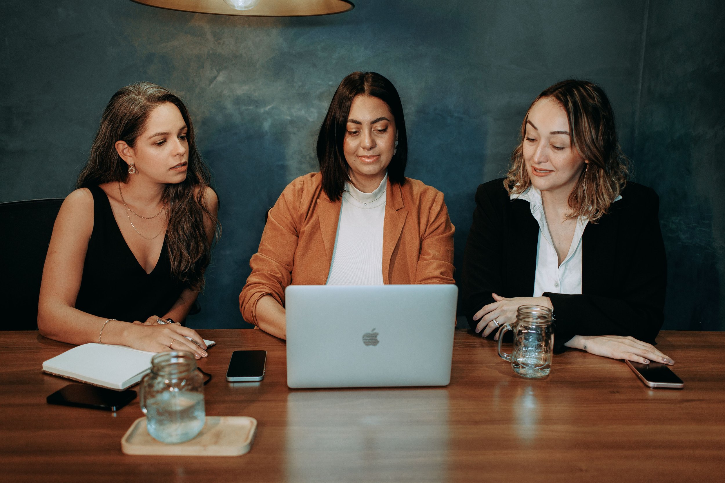 Group of people discussing work at a table