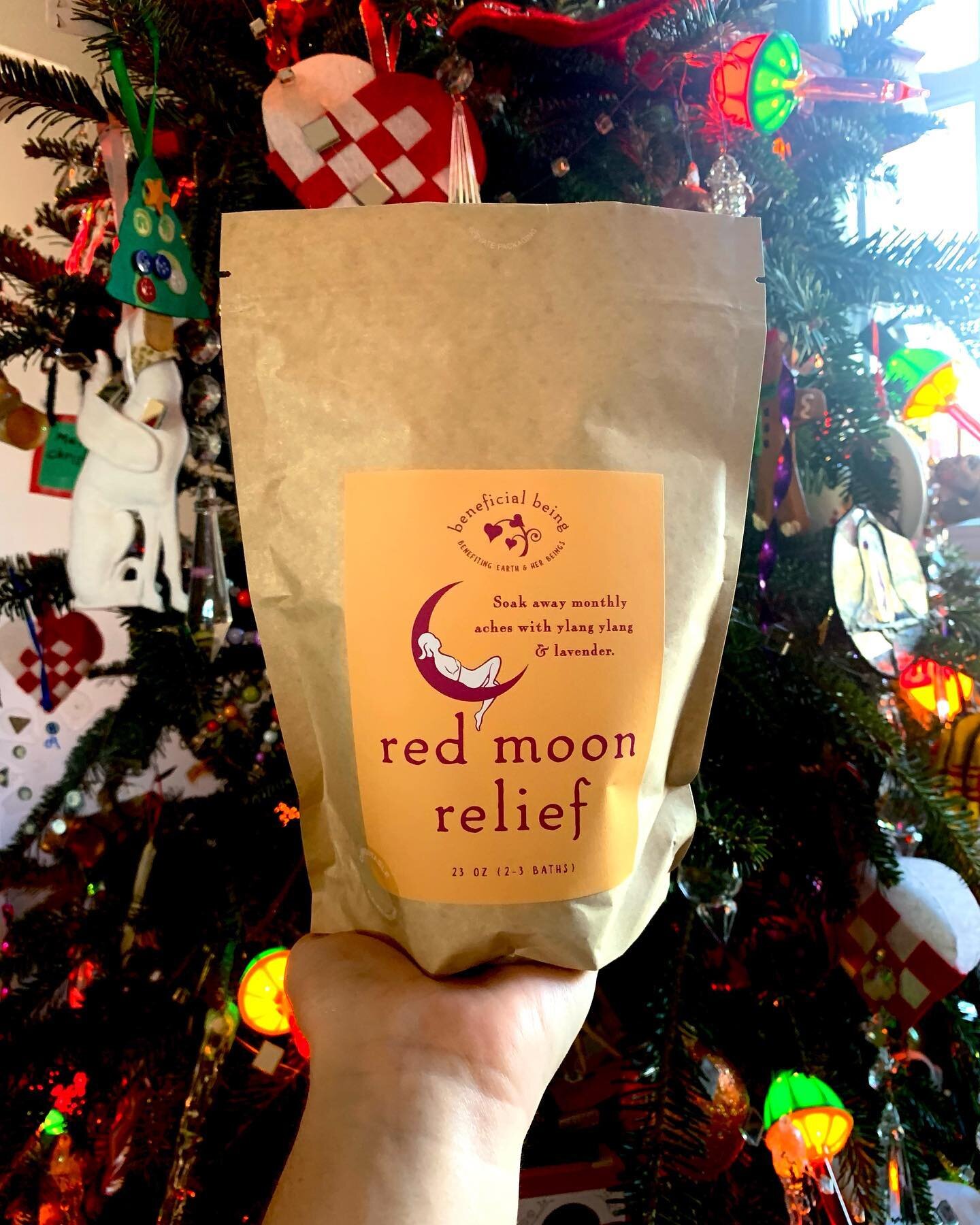 I think my mix of Red Moon Relief looks very festive against my Christmas tree. Speaking of festive, make sure to catch me at the Carolina Inn Holiday Market! 🎄❄️ #beneficialbeing #redmoonrelief #bathsalts #environmentallyfriendly #carolinainnholida