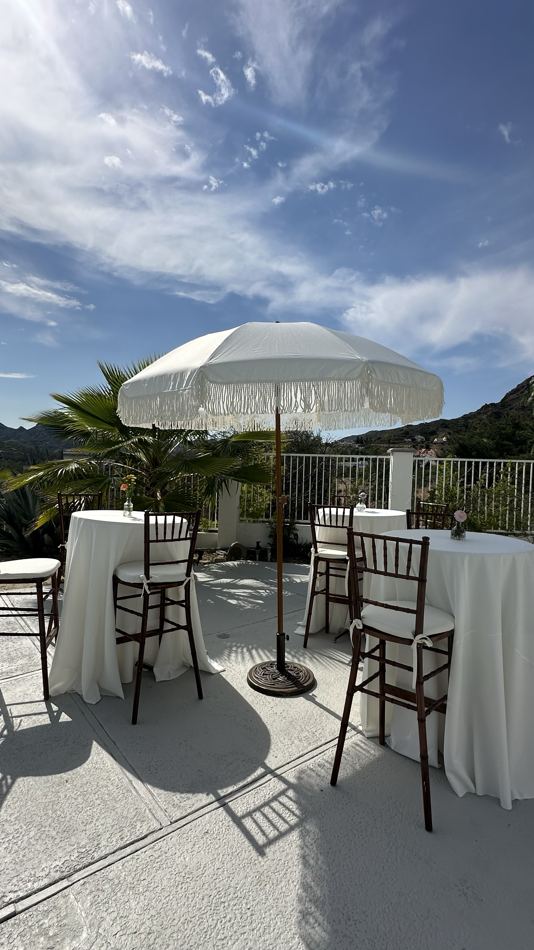 7' White umbrella with tassels - stand included ($55 each) - 2 Total