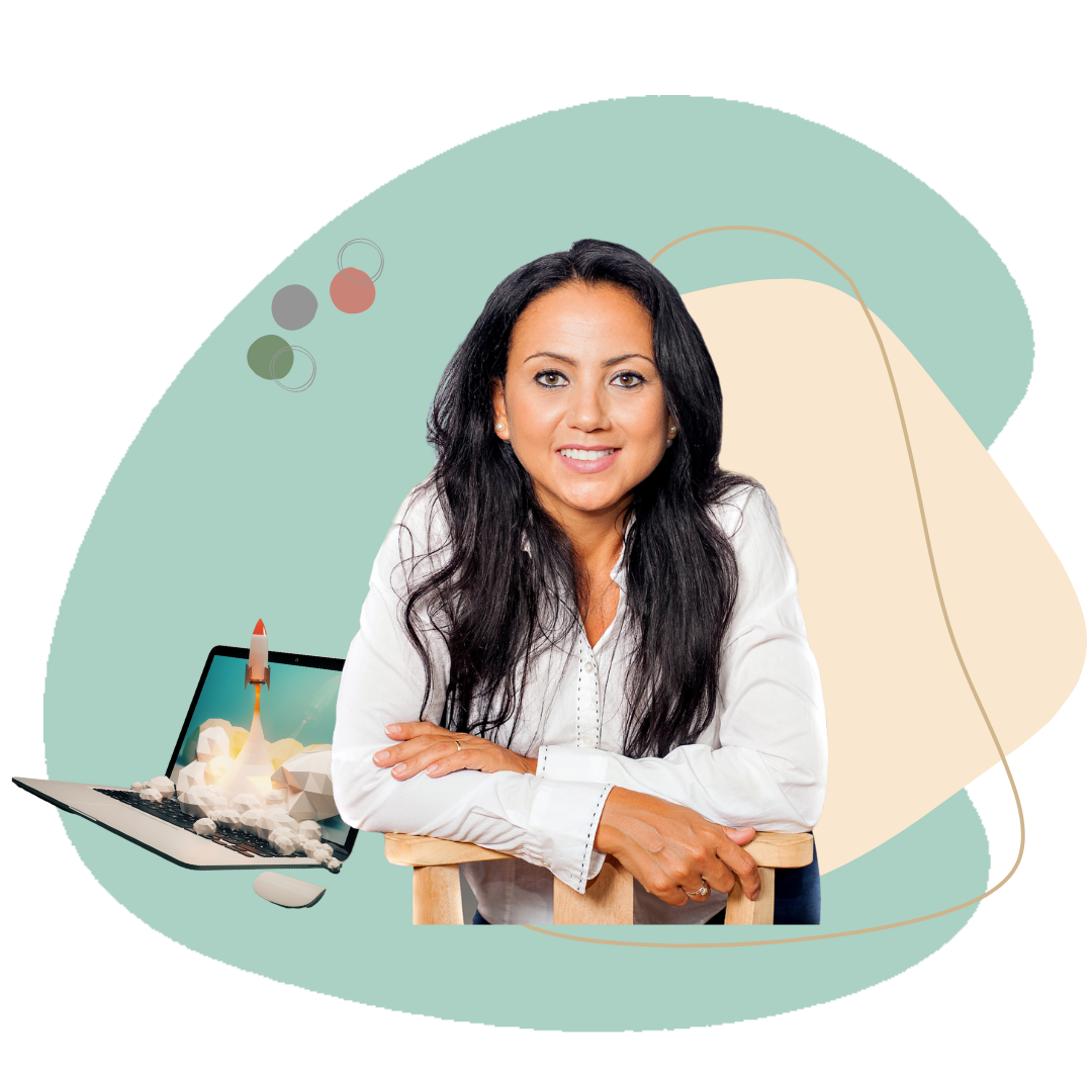 A woman with long black hair and a white blouse sitting at a wooden table, smiling at the camera, with a digital illustration of a rocket launch on a laptop screen behind her.
