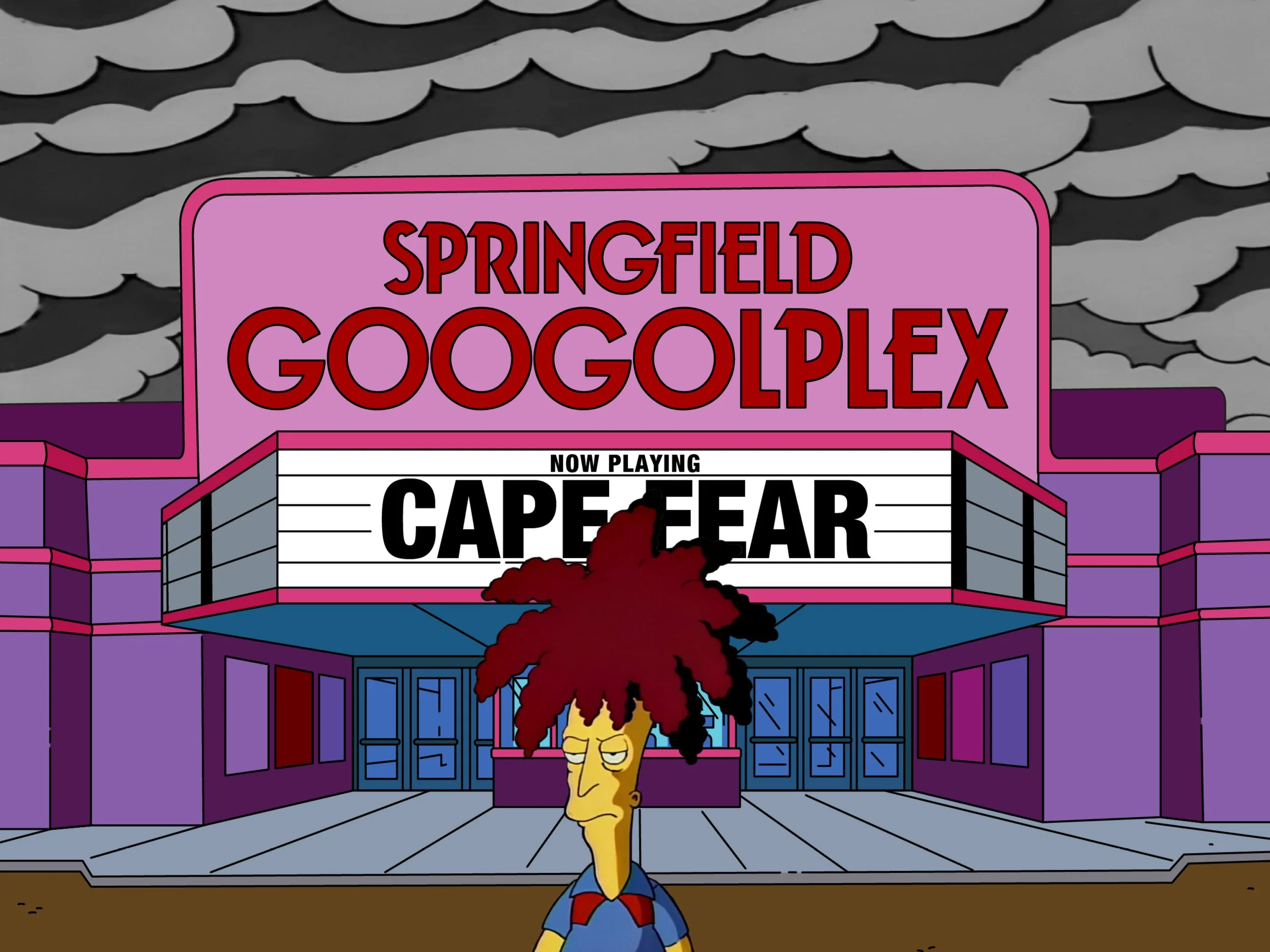 The Simpsons' Sideshow Bob walks in front of the Springfield Googolplex marquee, which reads, "Now Playing: Cape Fear." In the background, storm clouds loom.