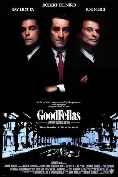 A poster for the movie Goodfellas, featuring Ray Liotta, Robert De Niro and Joe Pesci floating above a dead body lying in a New York street.