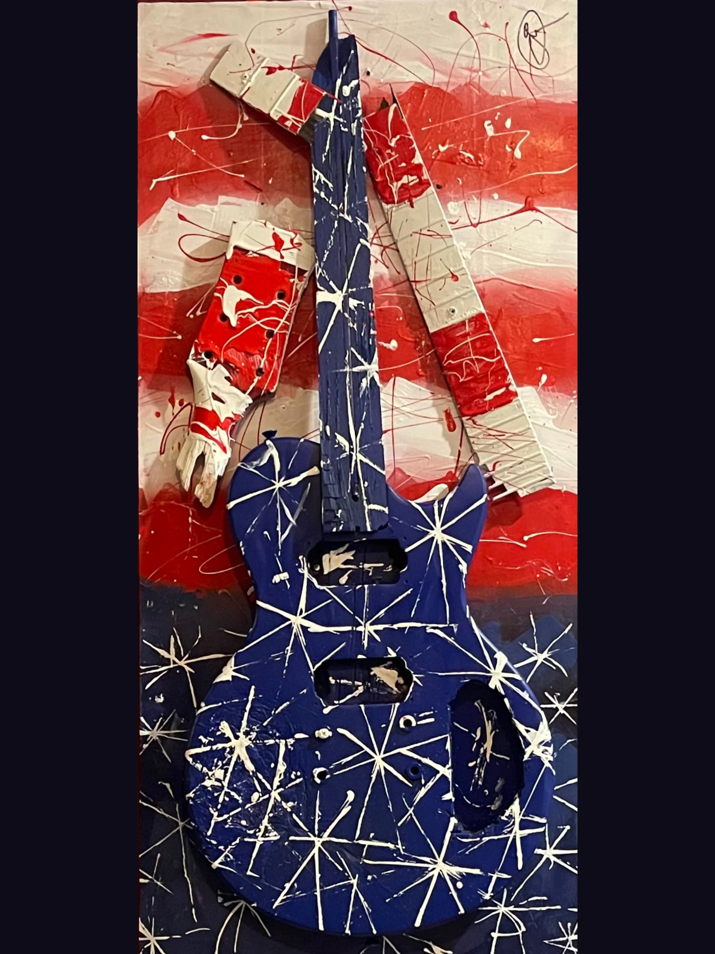 “JR.” Les Paul Jr. style guitar on wood.