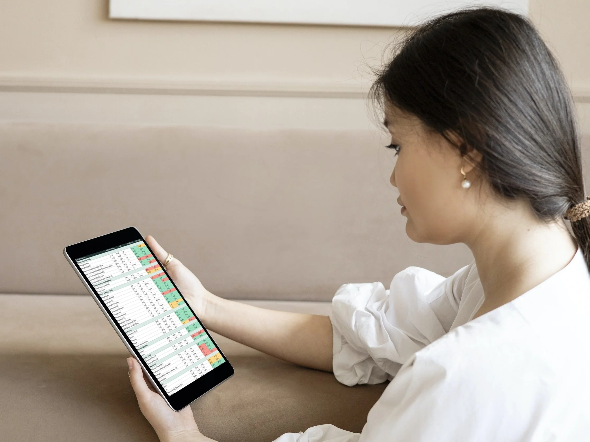 Women Looking at Blood Test Results on a Tablet
