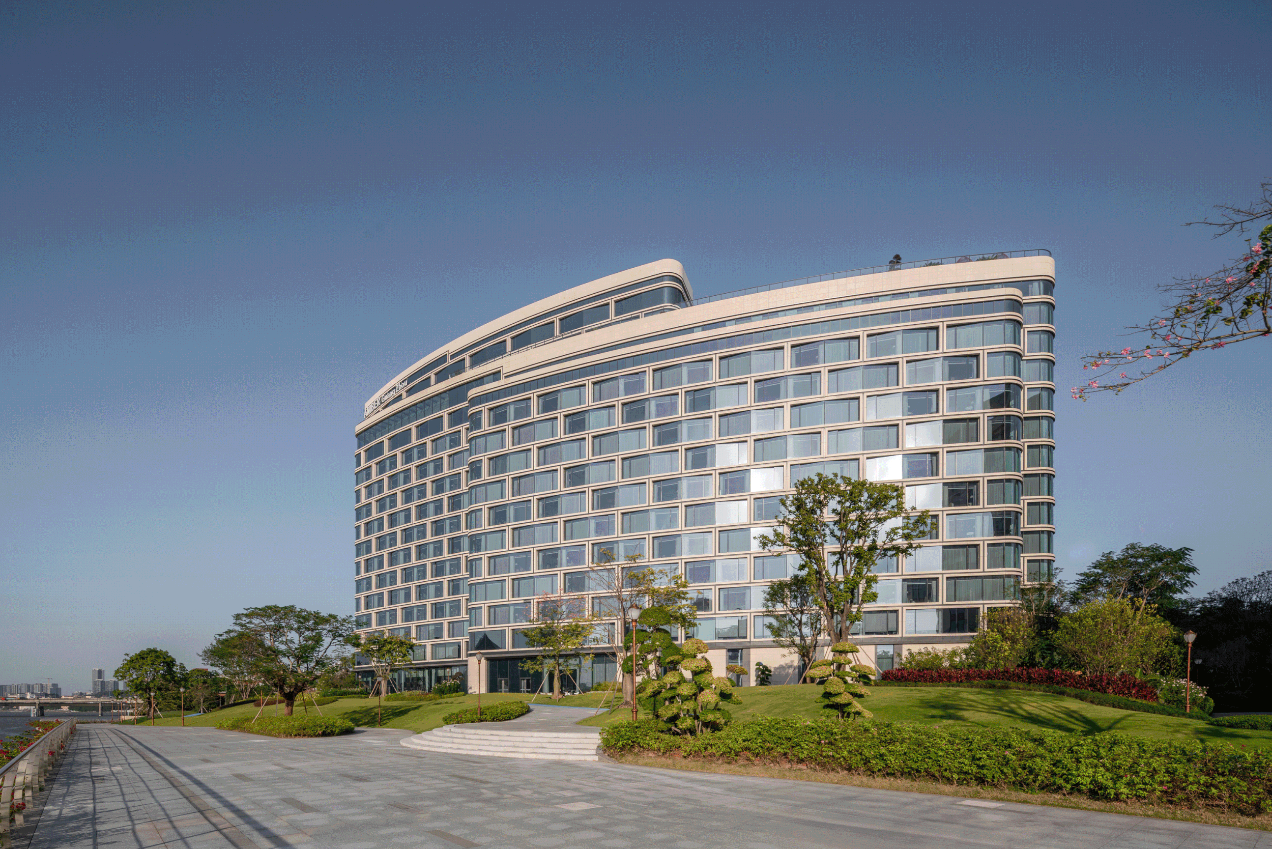 The hotel's river-facing facade and entrance.