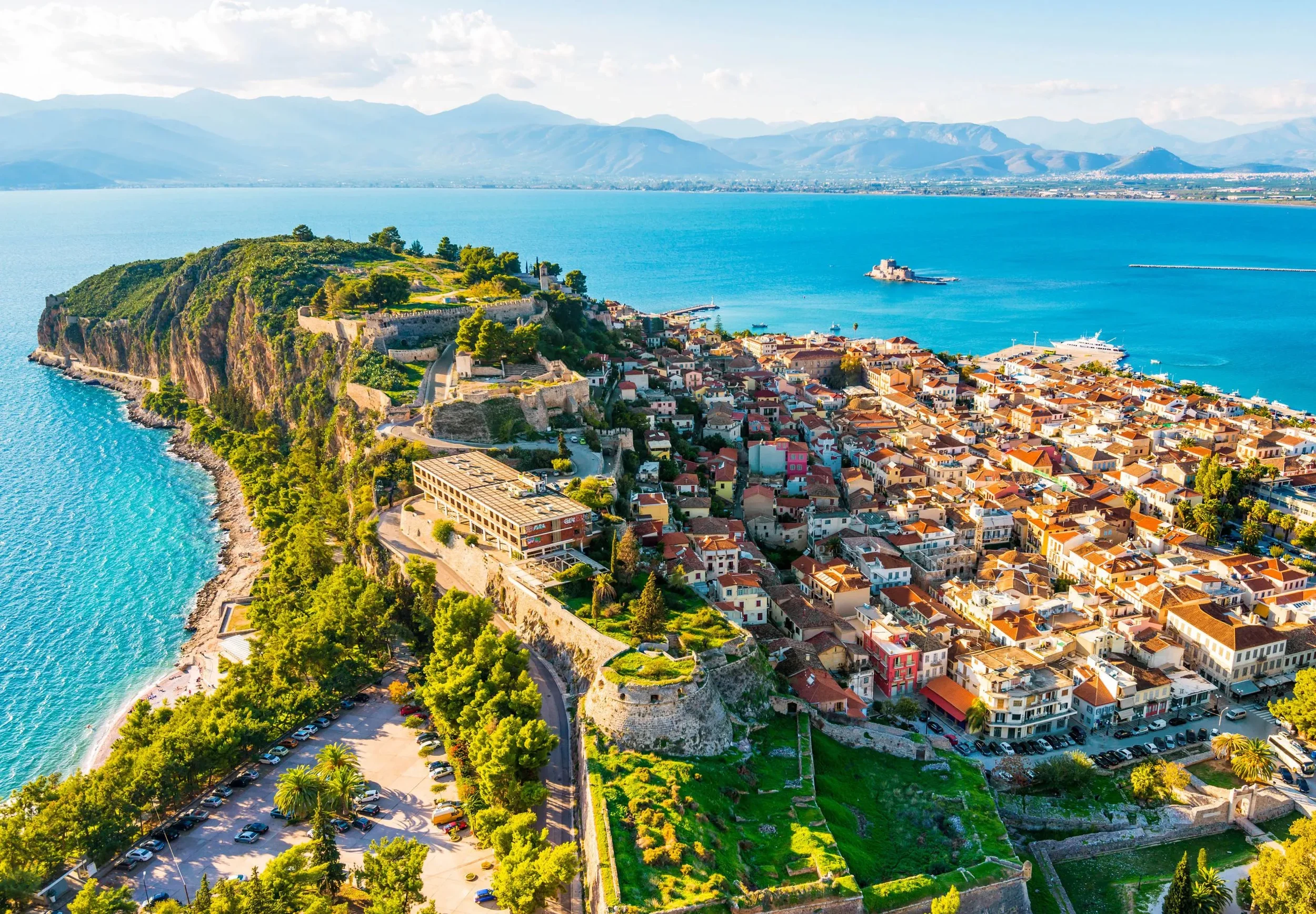 erial view of Nafplio old town, fortress walls, and the turquoise Argolic Gulf