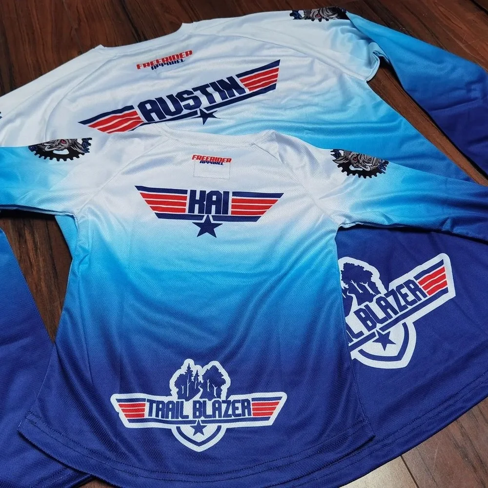 Two custom designed mountain bike jerseys for adult and child