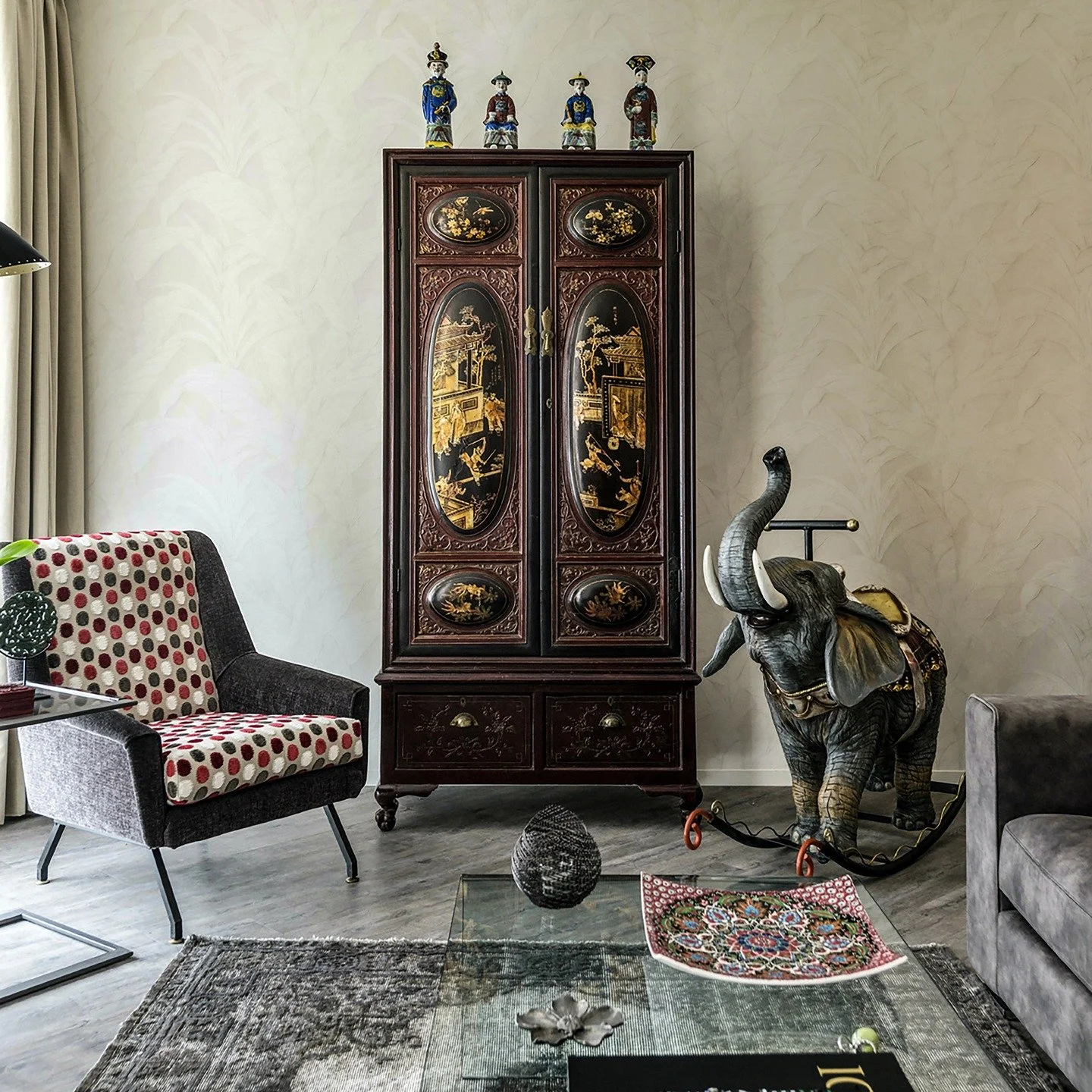 KalaRaraRoma Style Mix. 18th century Chinese wedding cabinet modified to be an illuminated bar cabinet. Italian mid-century Gigi Radice chairs reupholstered in Designers Guild fabric. One of a kind hand painted, cast fibreglass rocking elephant by Wa