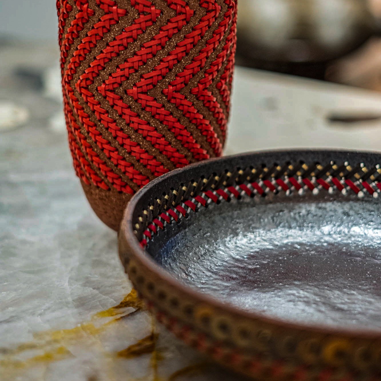 One of a kind vase and centerpiece. Sand infused, perforated clay with woven leather detailing, made by hand in France. #kalarararoma #ceramicartistry #ceramicaartigianale #ceramicdesign #madeinfrance🇫🇷 #ethnicmodern #leatherweaving