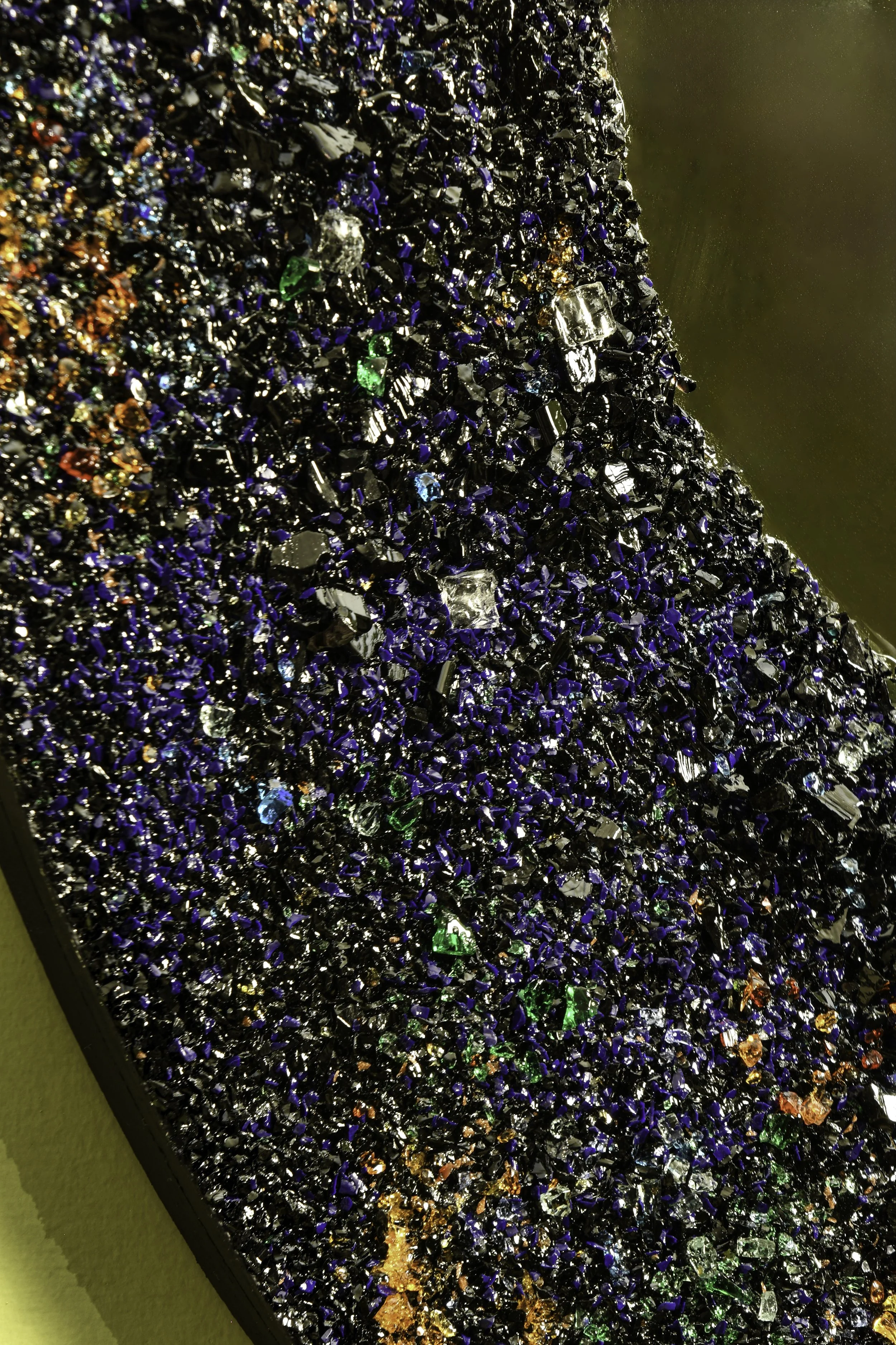 Murano glass crystals and shattered safety glass in black resin matrix