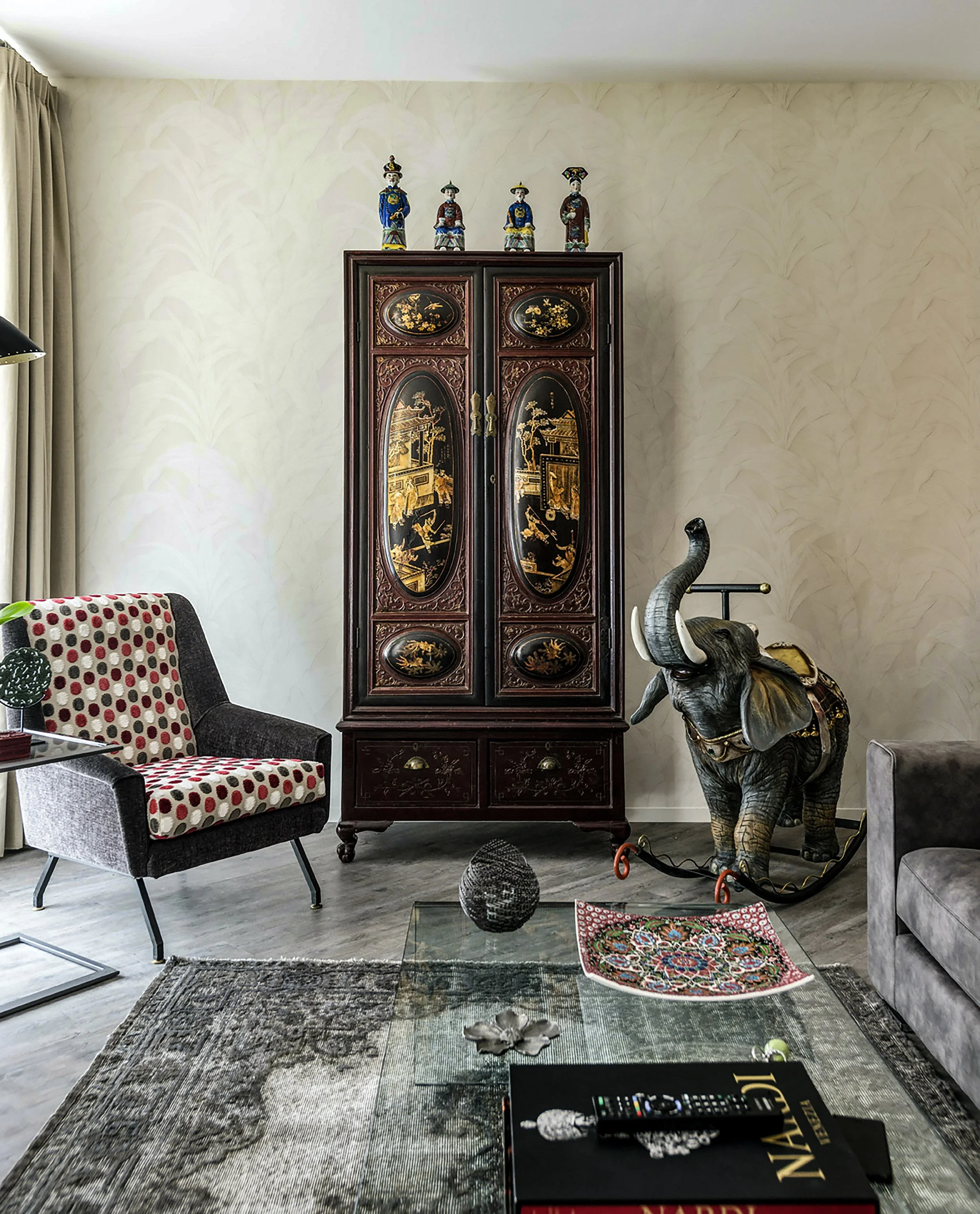 Marco Zanuso mid-century chair with nineteenth-century Chinese lacquer bar cabinet in Roman living room interior
