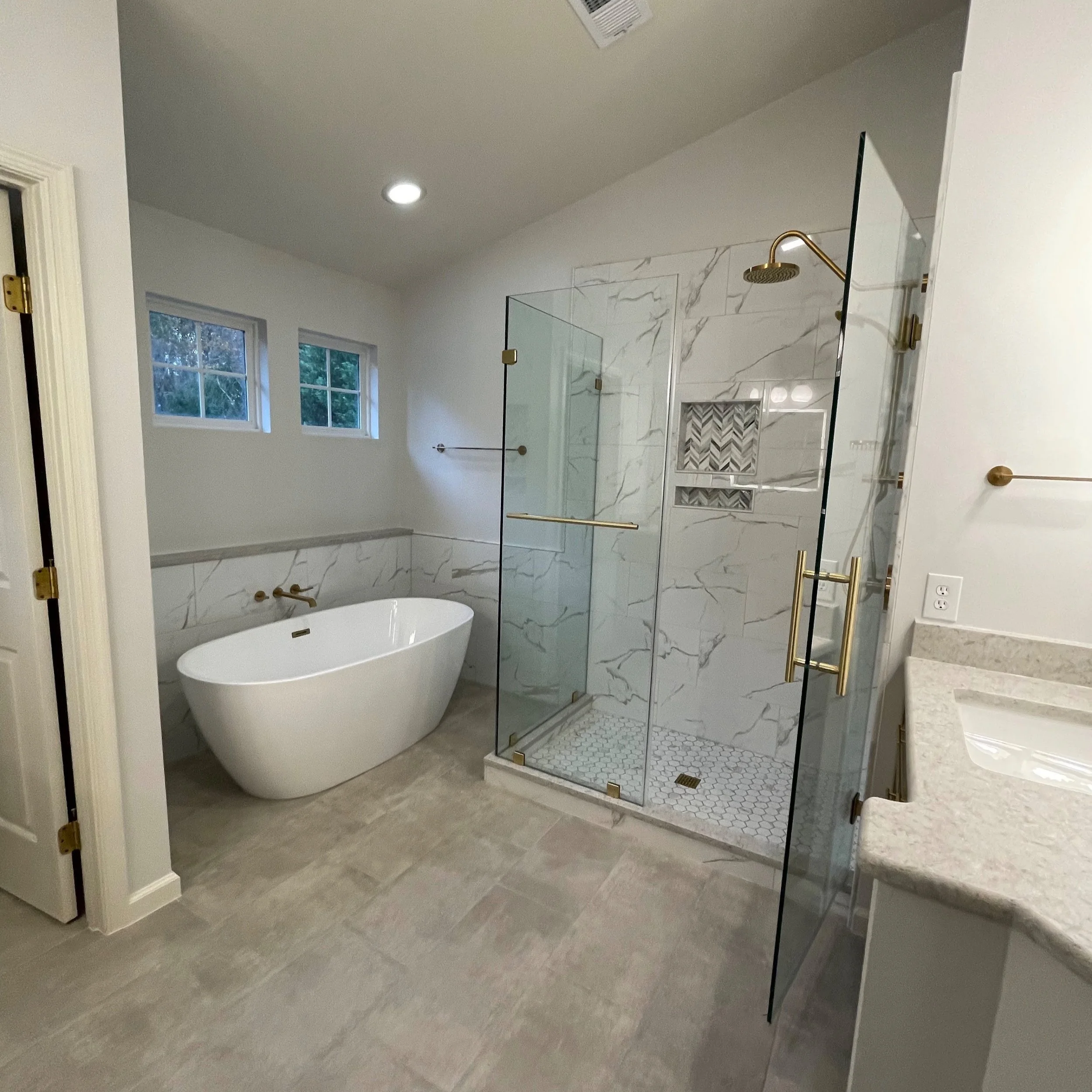 Complete redesign of jacuzzi tub and outdated shower stall and vanities
