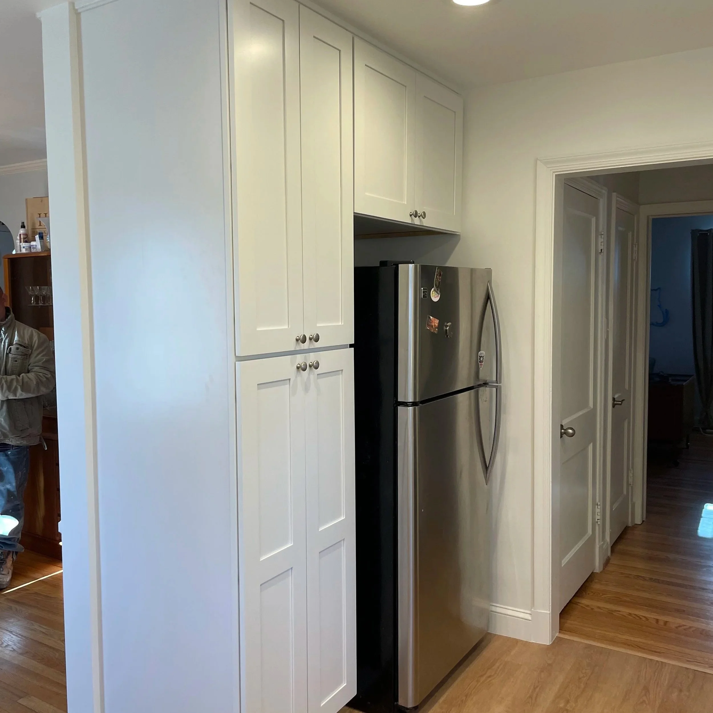 After: Taller, sleeker cabinetry from KCD is installed improving appearance and storage capacity.