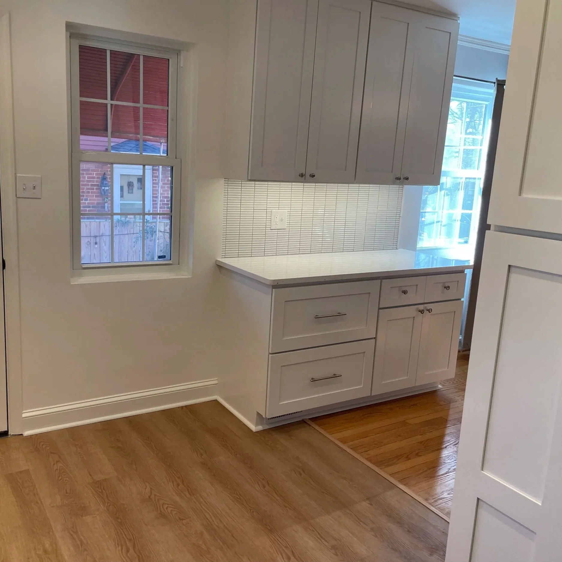 Additional storage and countertop space possible with removal of original short wall that enclosed the kitchen from dining space.