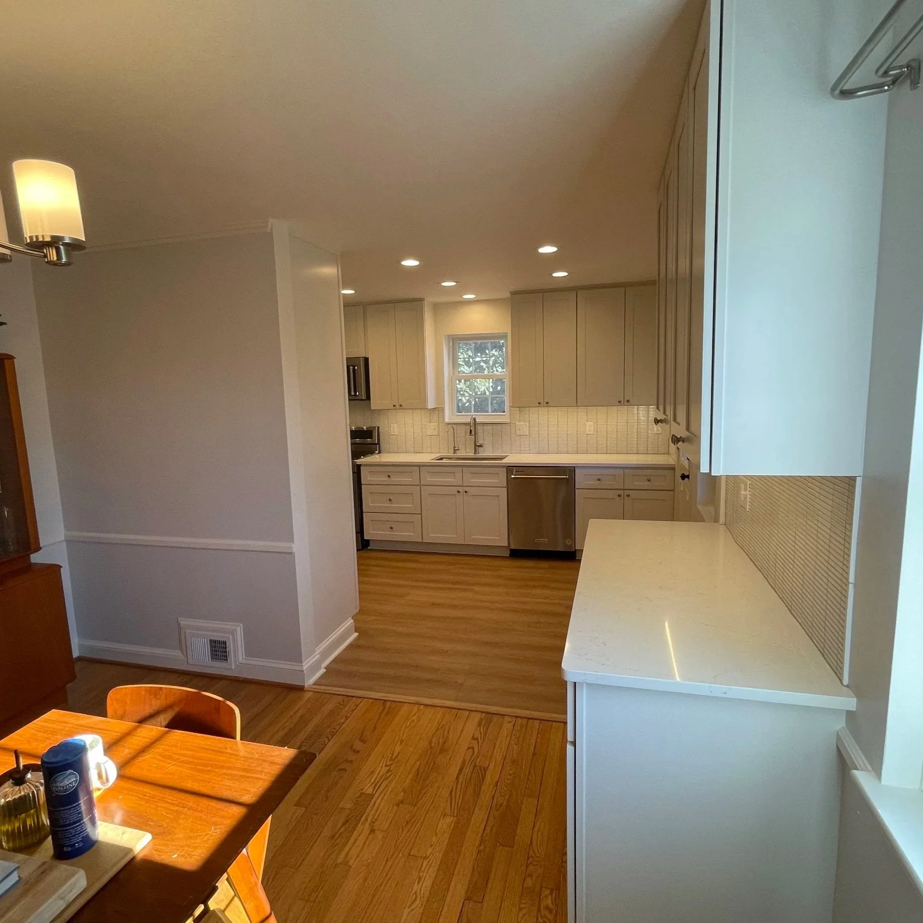 Design blends beautifully with adjacent dining space and preexisting flooring.