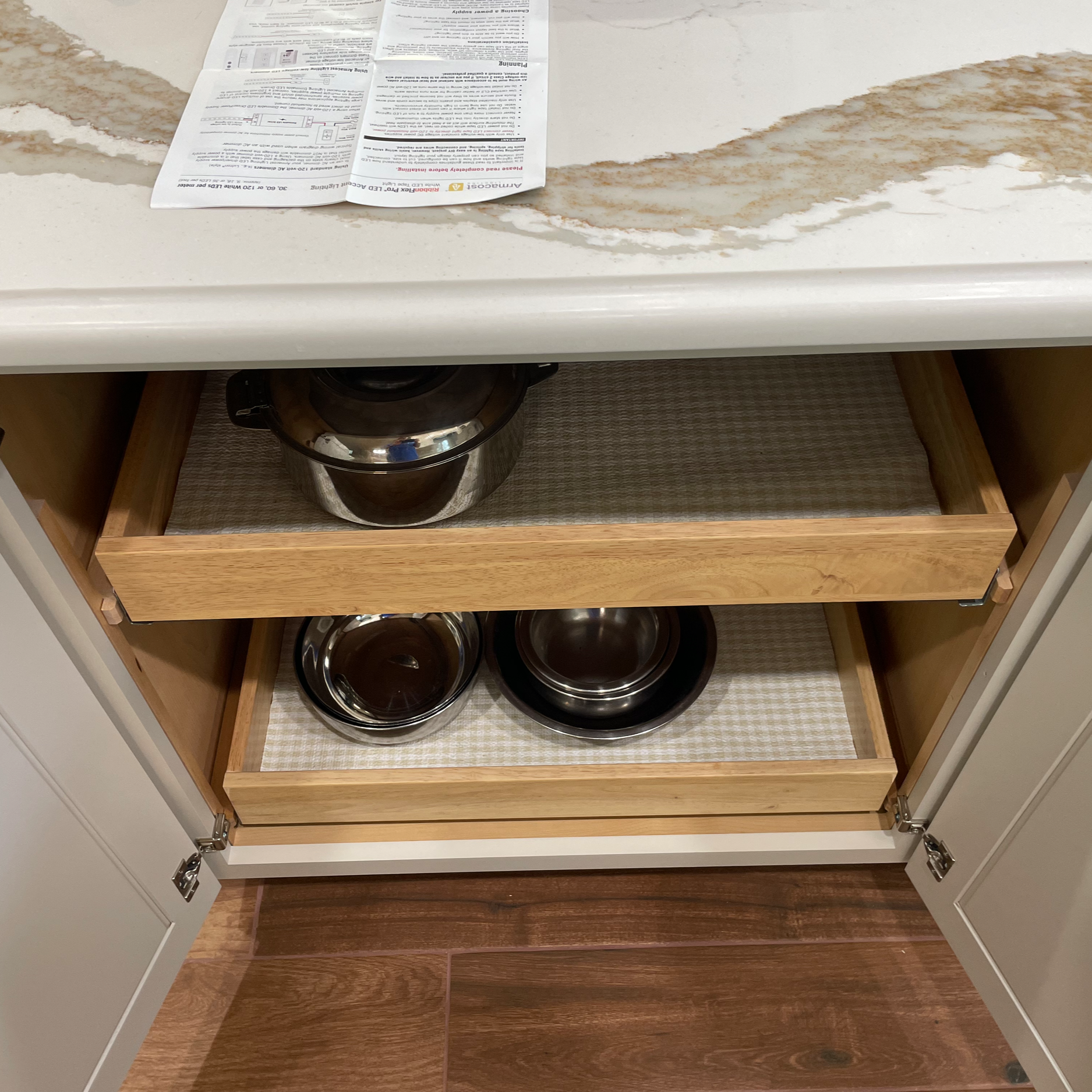Pull out shelving for easy retrieval of pan storage.