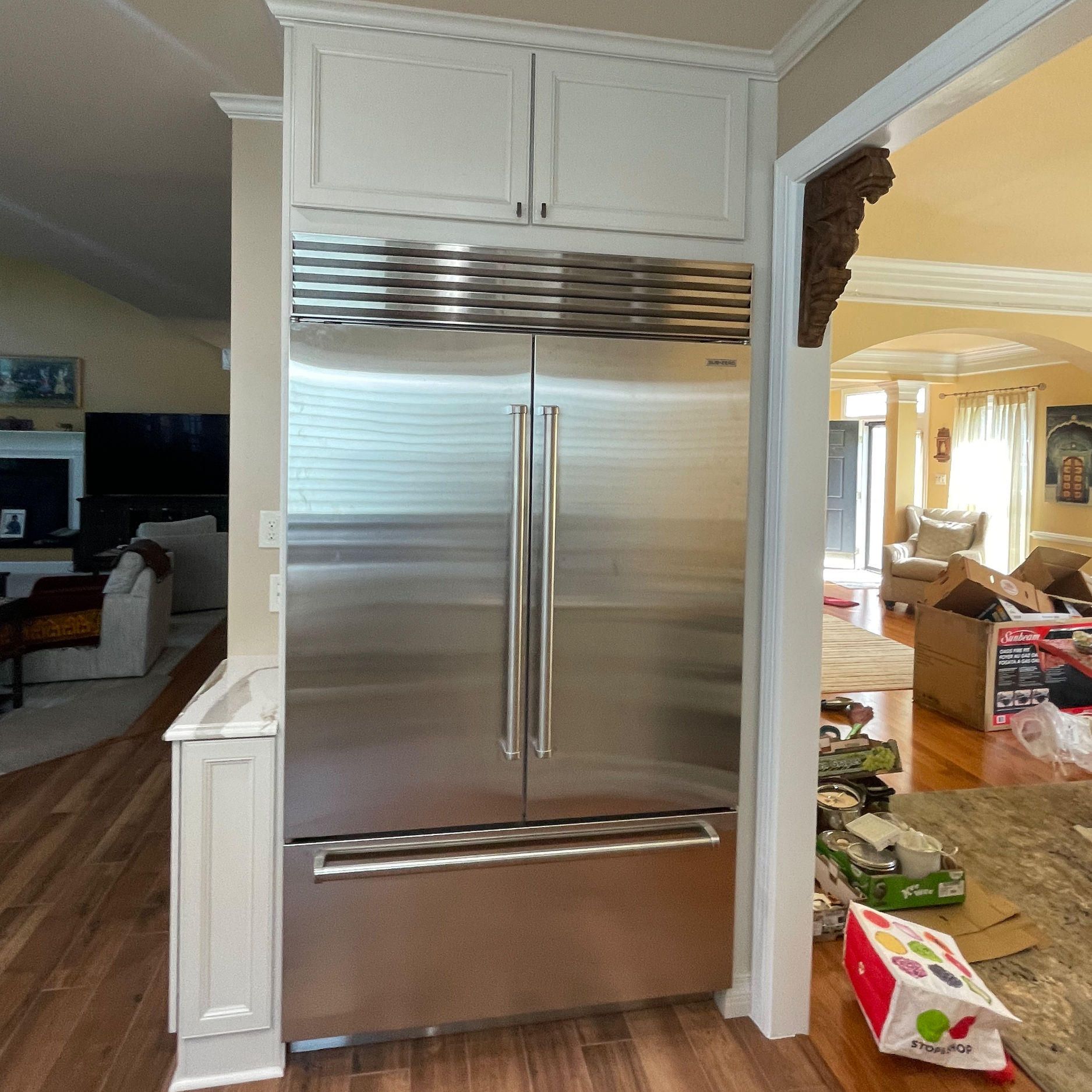 Relocated and replaced refrigerator with 48" french door Sub-Zero.