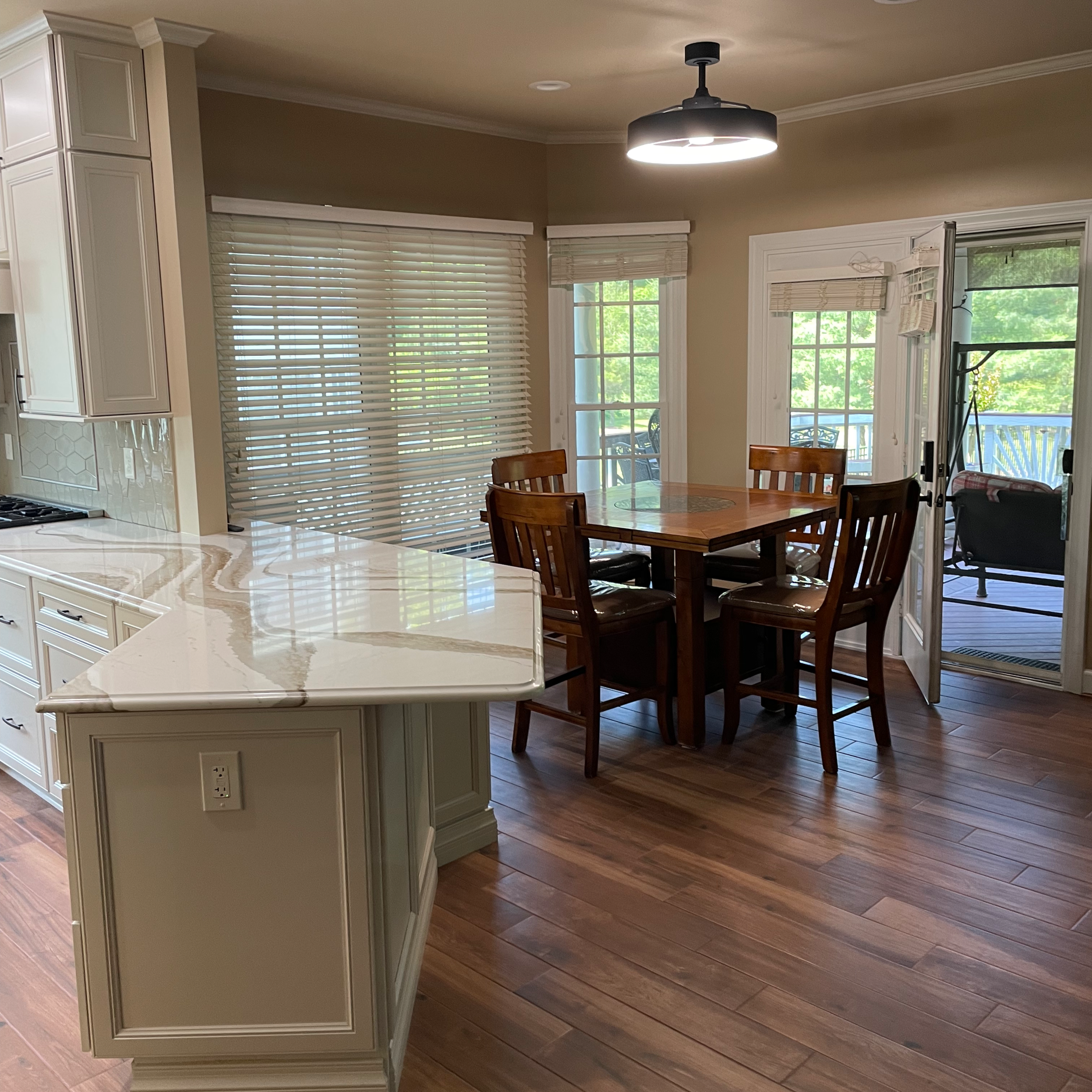 Replaced kitchen and adjacent small dining space flooring with Palmetto Chestnut porcelain tile by MSI. Installed heated system beneath.