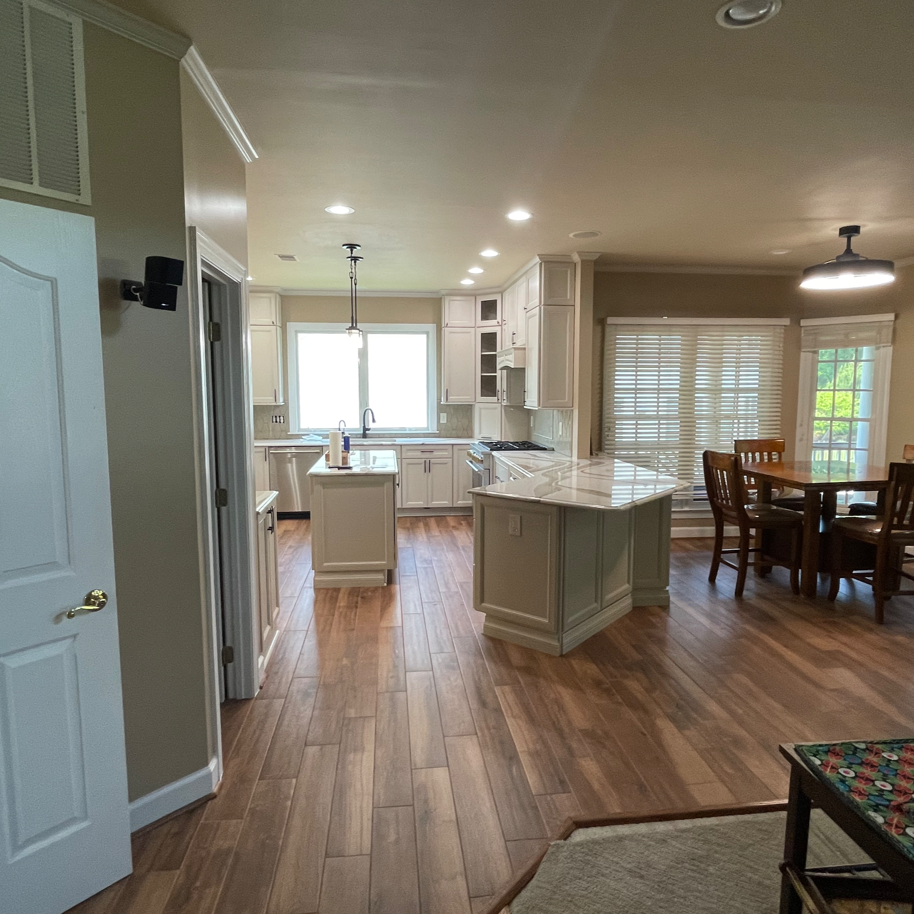 Replaced kitchen and dining room flooring with Palmetto Chestnut porcelain tile by MSI. Installed heated system beneath.