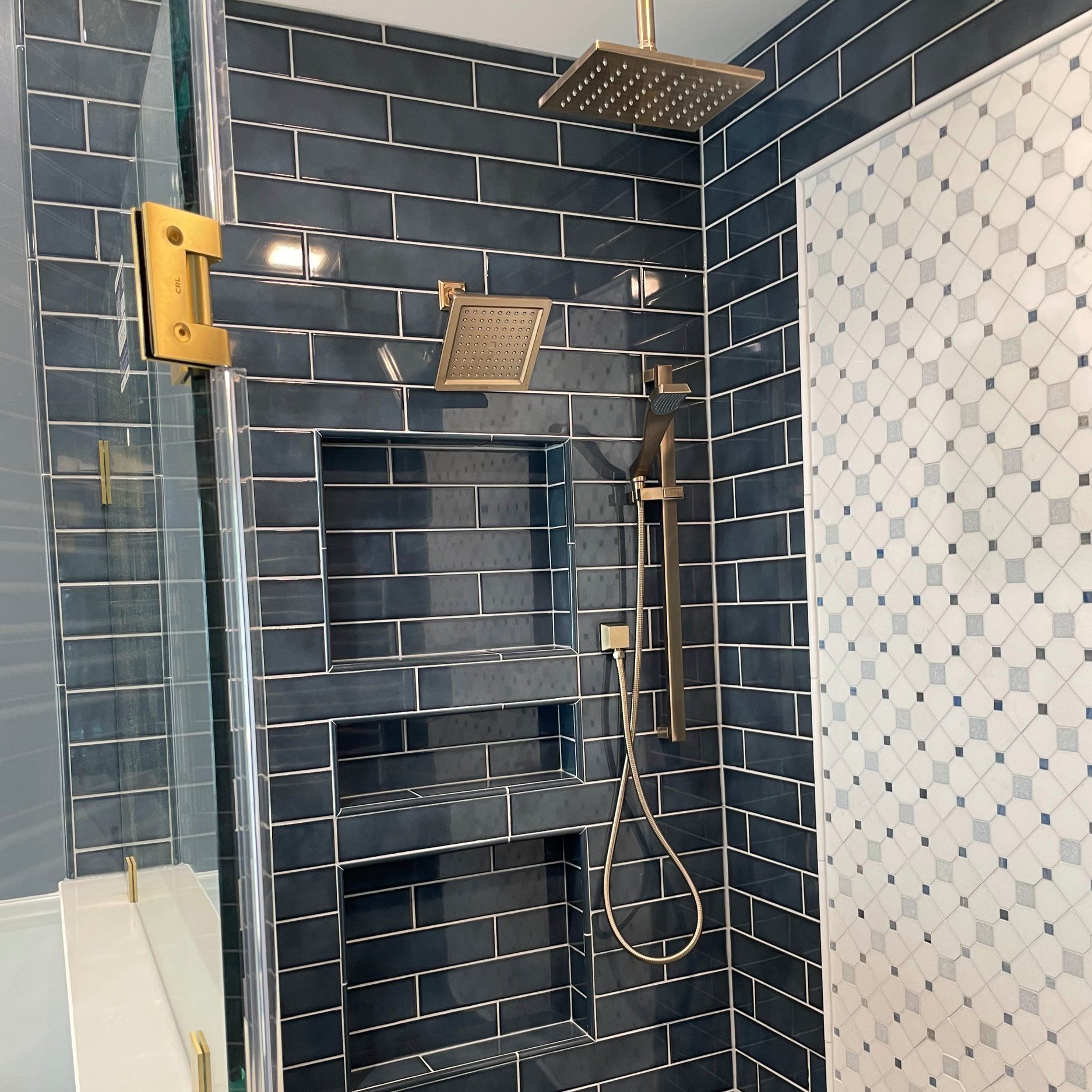 Three Niches and Brushed Gold Fixtures and Body Sprayer