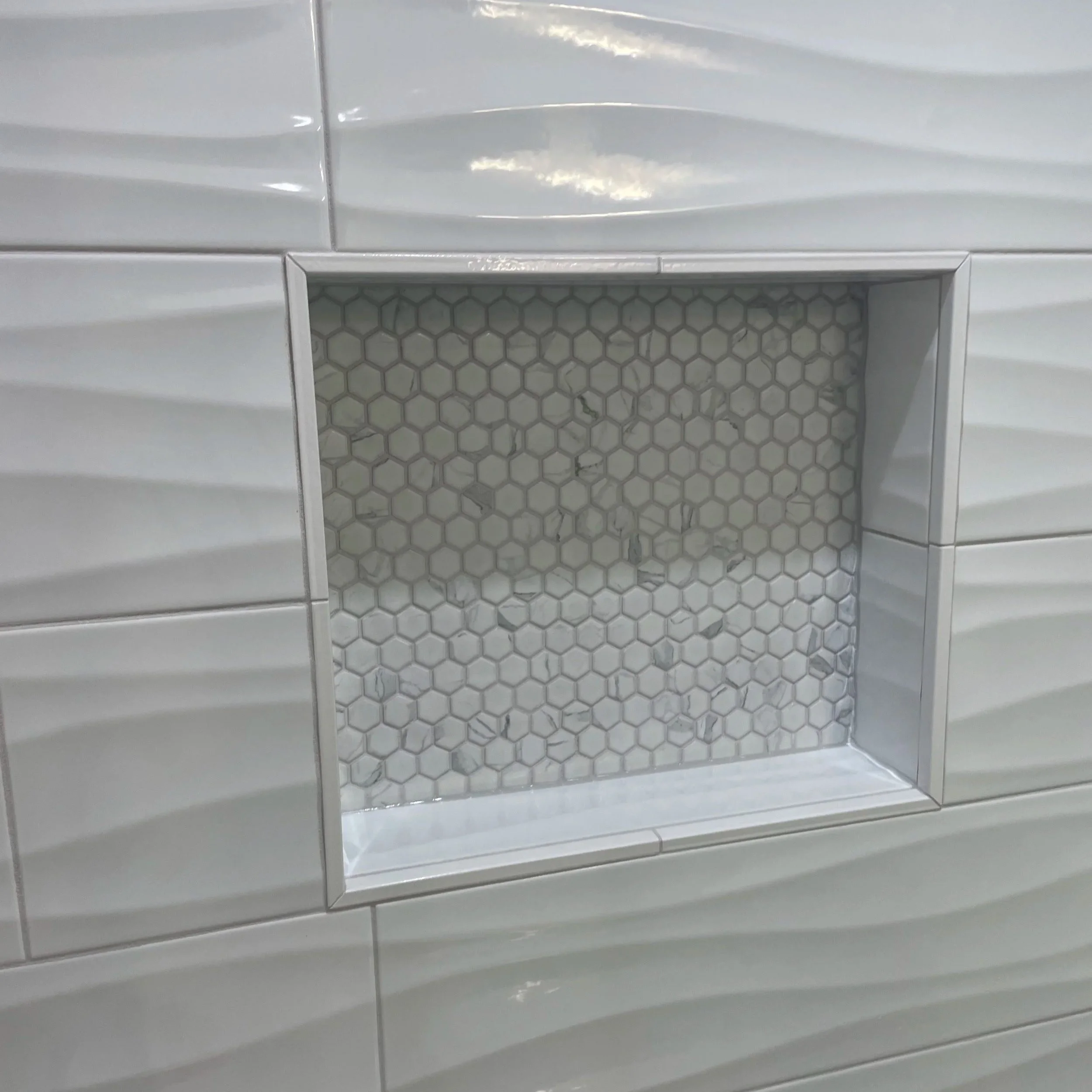 Generous niche with matching hexagon tile