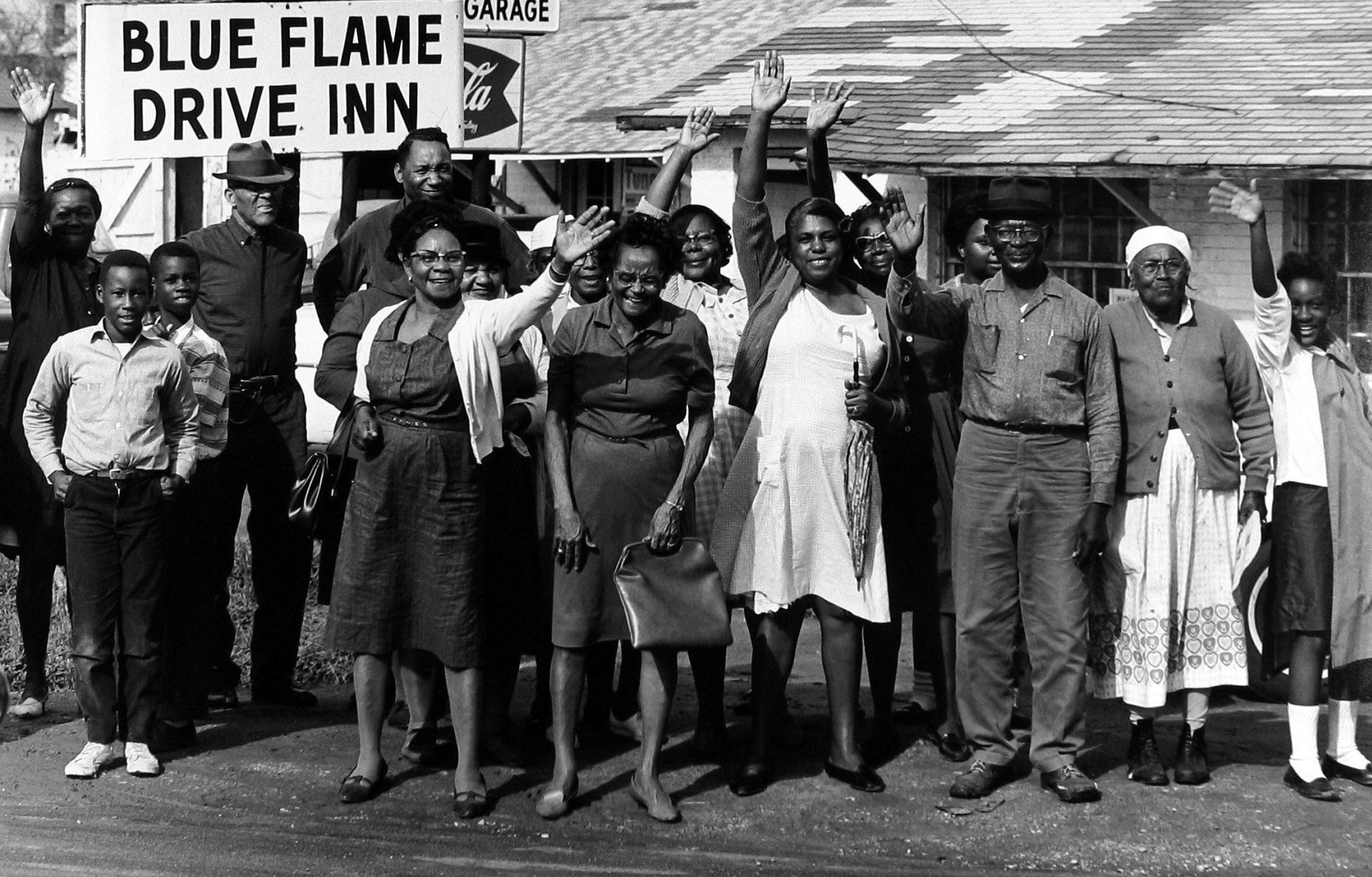 A030_1965-03-00_Black spectators wave Selma to Montgomery March.jpeg
